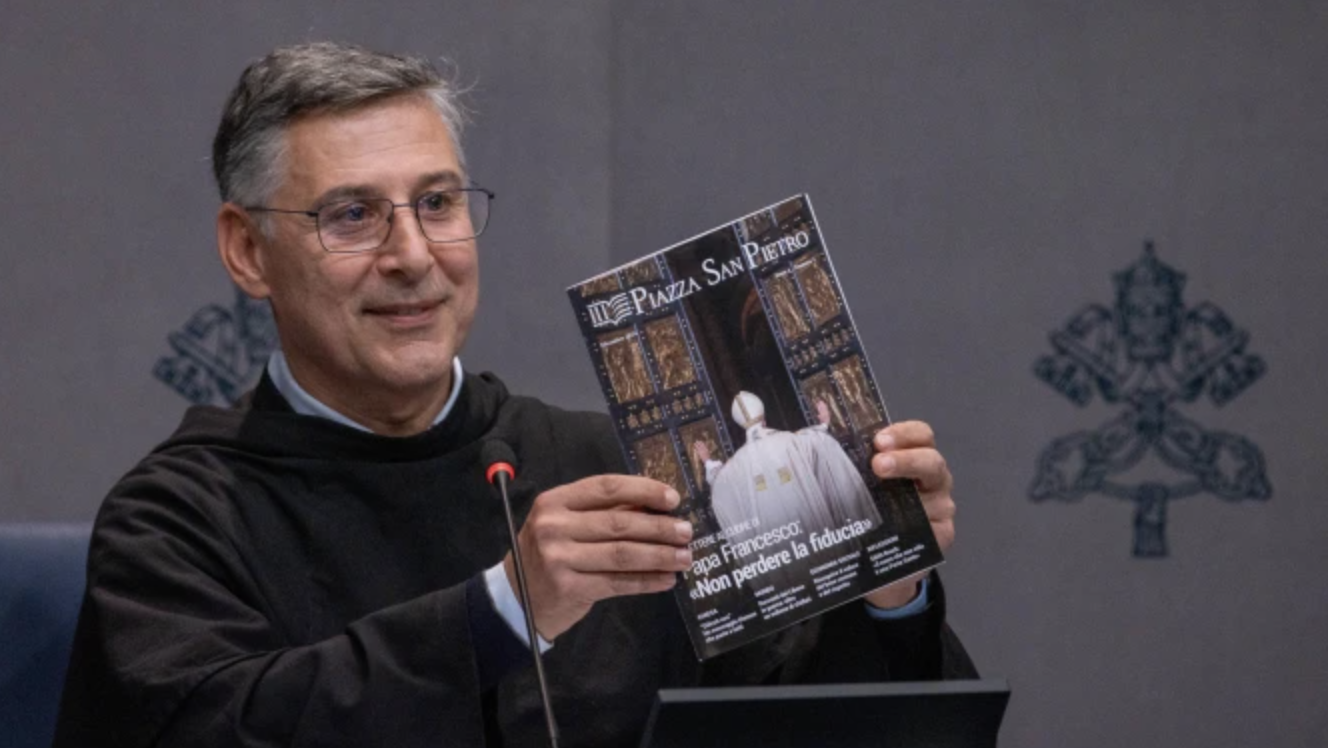 Father Enzo Fortunato, OFM Conv., communications director for St. Peter’s Basilica, holds up a copy of the first issue of the Vatican's new monthly magazine, “Piazza San Pietro.” (Daniel Ibáñez/EWTN News)