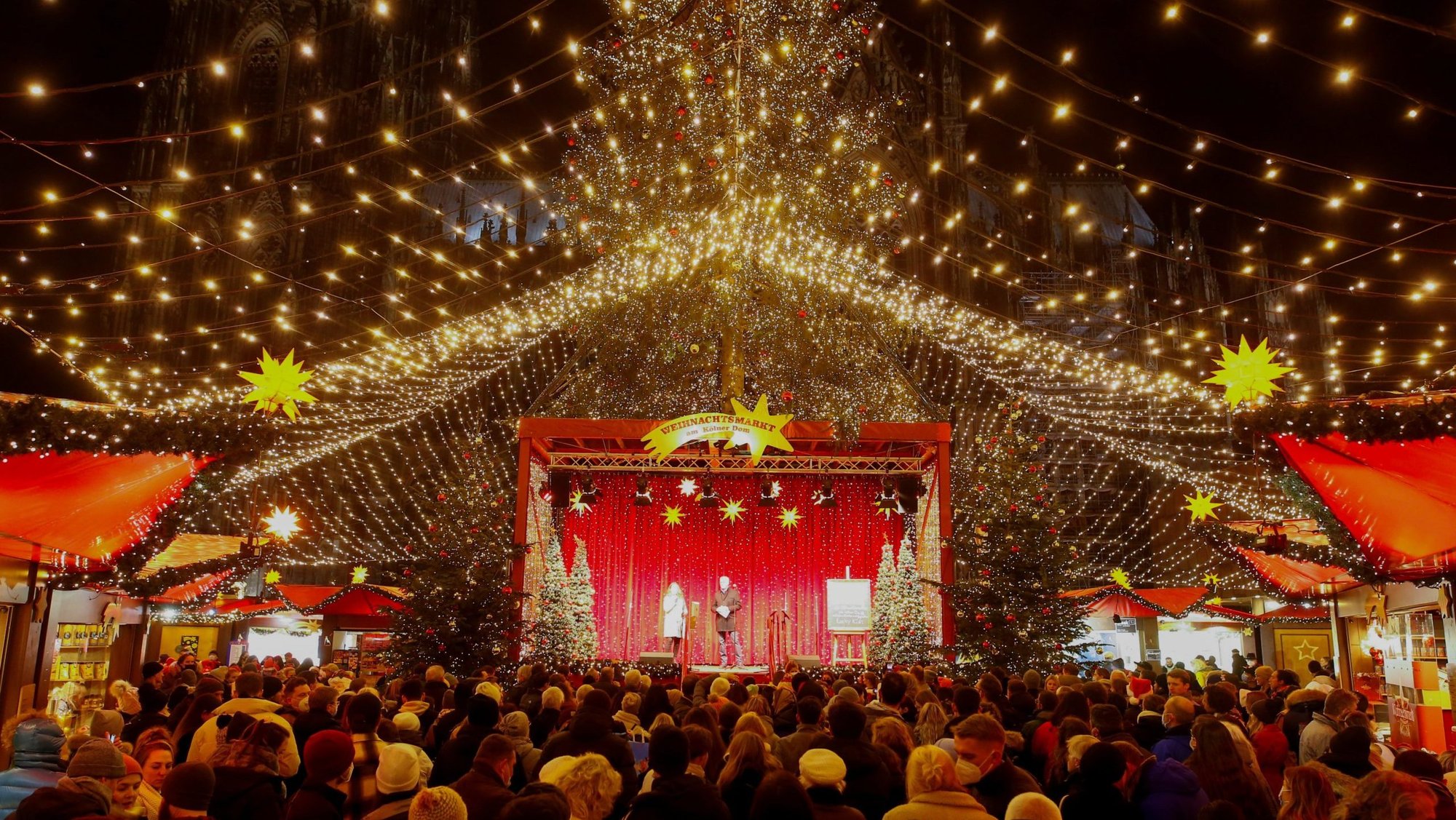 People attend the opening ceremony of a Christmas market in Cologne, Germany, Nov. 22, 2021. (CNS/Thilo Schmuelgen, Reuters)