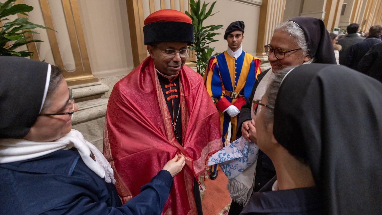 Cardinal George J. Koovakad, an official in the Vatican Secretariat of State, greets visitors in the Apostolic Palace at the Vatican Dec. 7, 2024. (CNS photo/Pablo Esparza)