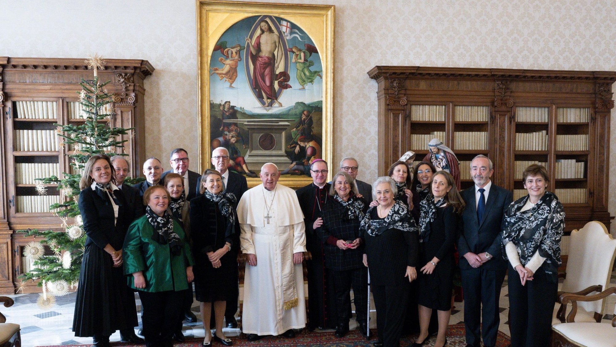 Pope Francis poses for a photograph with a delegation of Manos Unidas during an audience in the Apostolic Palace at the Vatican Dec. 9, 2024. Manos Unidos is a Catholic organization based in Spain that promotes aid and development in developing nations, particularly in the fight against hunger. (CNS photo/Vatican Media)