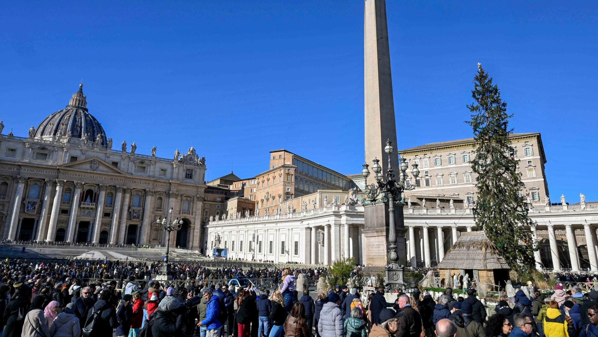 People gather in St. Peter’s Square to join Pope Francis in praying the Angelus on the feast of St. Stephen, Dec. 26, 2024. (CNS photo/Vatican Media)