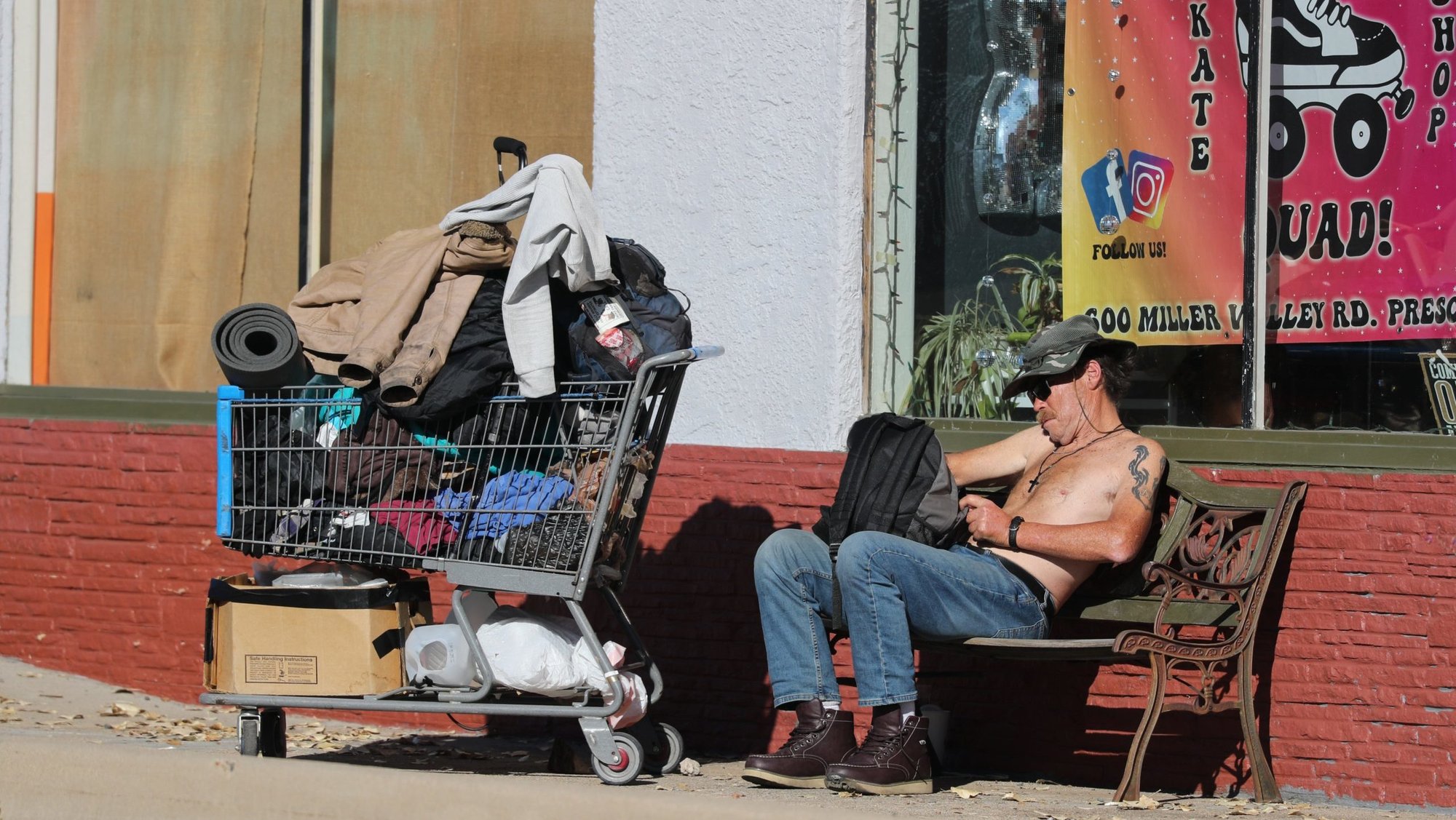 A homeless man sits with his belongings in Prescott, Ariz., Dec. 9, 2024. On Dec. 27, the U.S. Department of Housing and Urban Development released its 2024 Annual Homelessness Assessment Report, which found homelessness in the U.S. has surged 18% to a new record in 2024. (OSV News photo/Bob Roller)