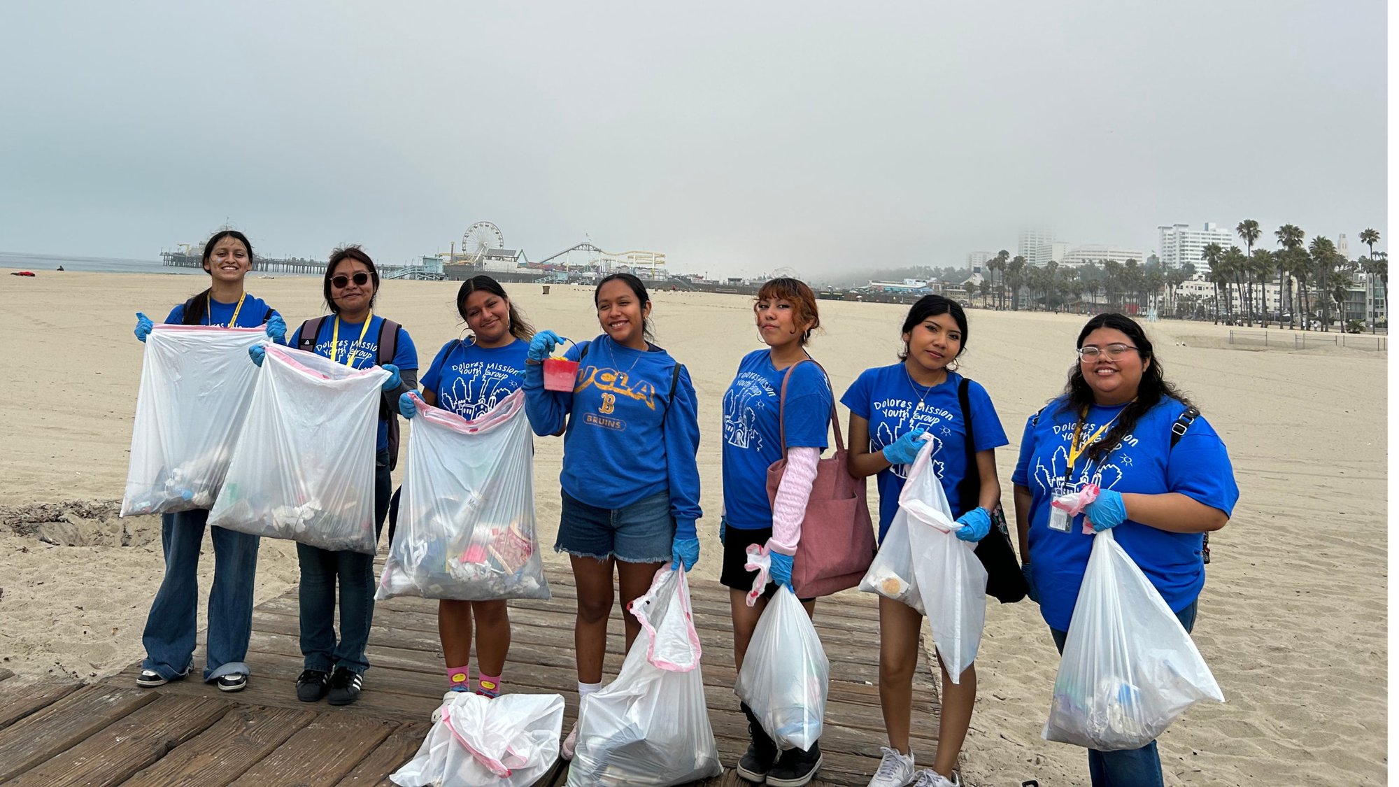 Members of the Dolores Mission Church Youth Group help clean up Santa Monica State Beach as part of its youth ministry expansion thanks to Called to Renew funding. (Dolores Mission)