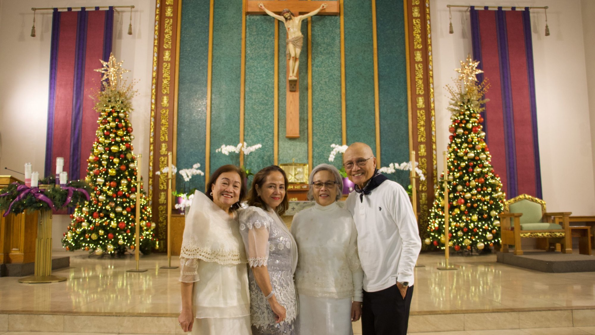 Parish volunteers Mila Villanueva, Helen Limbo, Yvonne Gandhi, and Carlito Rafanan pose after the early-morning Simbang Gabi novena at Holy Family Church in Artesia. (Kimmy Chacón)