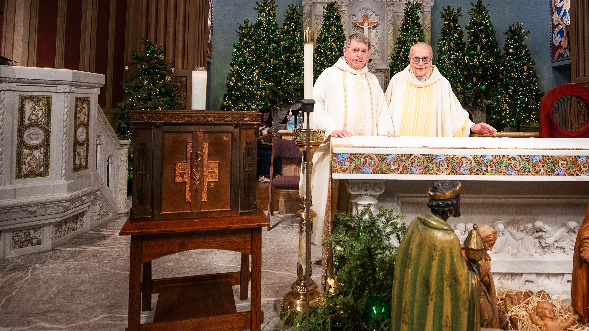 Msgr. Liam Kidney (left) and Msgr. Lloyd Torgerson are pictured at St. Monica Church with the recovered tabernacle from Corpus Christi Church. (Victor Alemán)