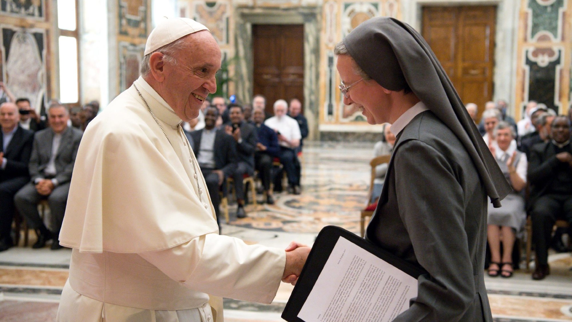 Pope Francis greets Consolata Sister Simona Brambilla, superior general of the Consolata Missionary Sisters, during a June 5 audience with the men's and women's branches of the religious missionary congregation. (CNS photo/L'Osservatore Romano)