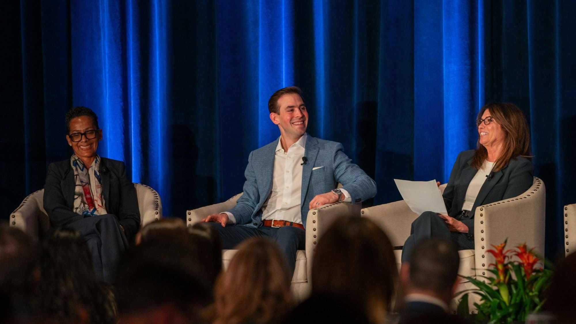 Dodgers announcer and Fox Sports broadcaster Joe Davis shares a light moment with panelist Renata Simril and moderator Carol Costello. (John Rueda)