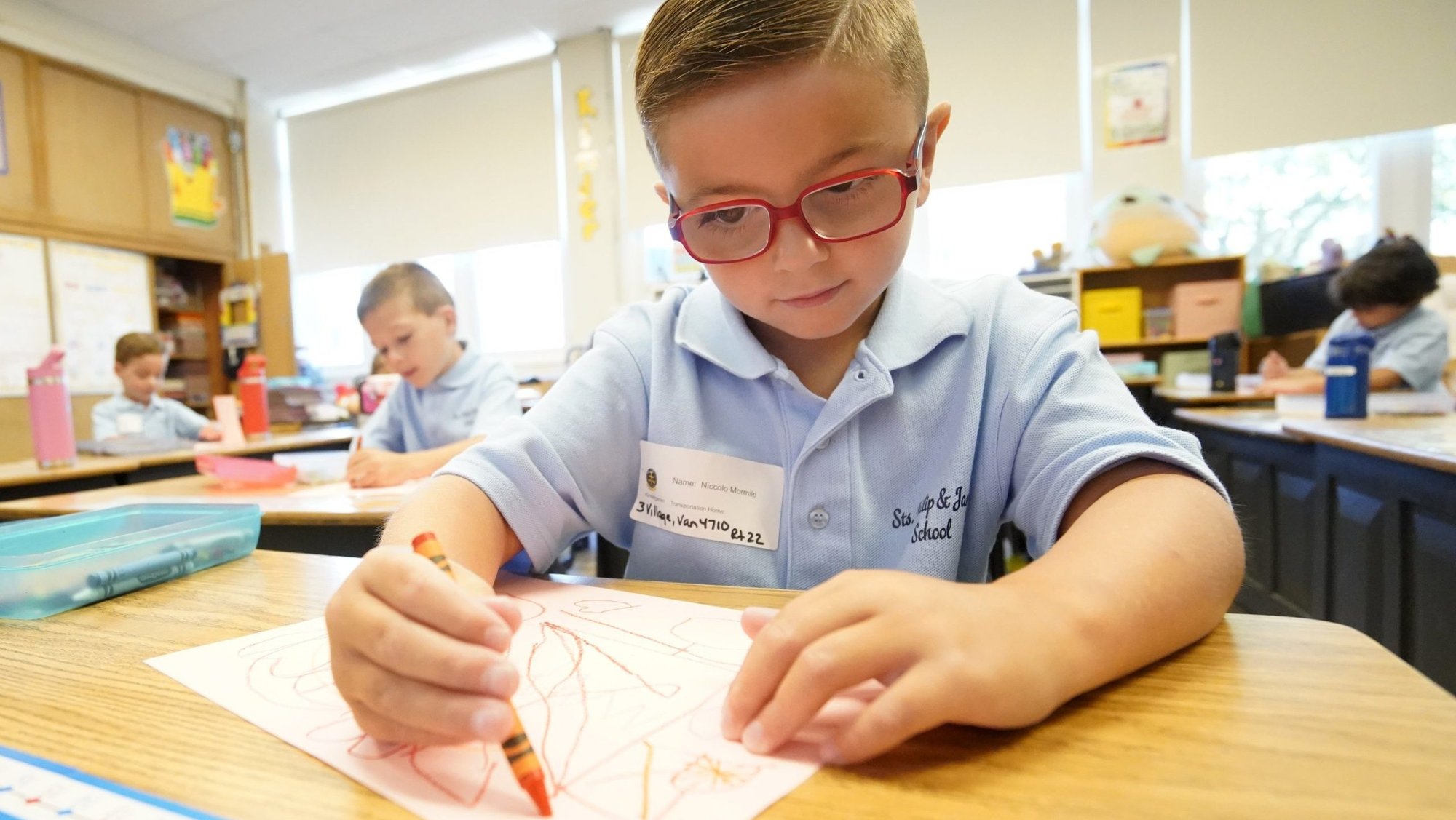Kindergartener Niccolo Mormile uses a crayon as he works on an assignment on the first day of classes at Sts. Philip and James School in St. James, N.Y., Sept. 4, 2024. (OSV News photo/Gregory A. Shemitz)