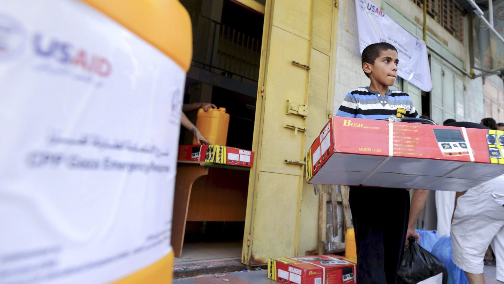 A boy is seen in a file photo with relief goods at a U.S. Agency for International Development (USAID) distribution center in Gaza City. The future of USAID has been called into question amid reports President Donald Trump had agreed to "shut down" the agency, which could have dramatic impacts on the poor and the groups assisting them. (OSV News photo/Shareef Sarhan, for Catholic Relief Services)