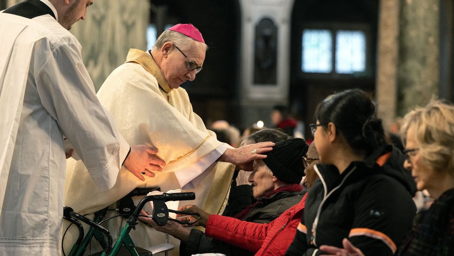 Bishop Paul Mason of the Military Ordinariate of Great Britain, who heads the health and social care division of the Bishops' Conference of England and Wales, blesses a woman during Mass at London's Westminster Cathedral Feb. 8, 2025. The Mass was celebrated in honor of the feast of Our Lady of Lourdes and World Day of the Sick on Feb. 11. (OSV News photo/Marcin Mazur, Bishops' Conference of England and Wales)