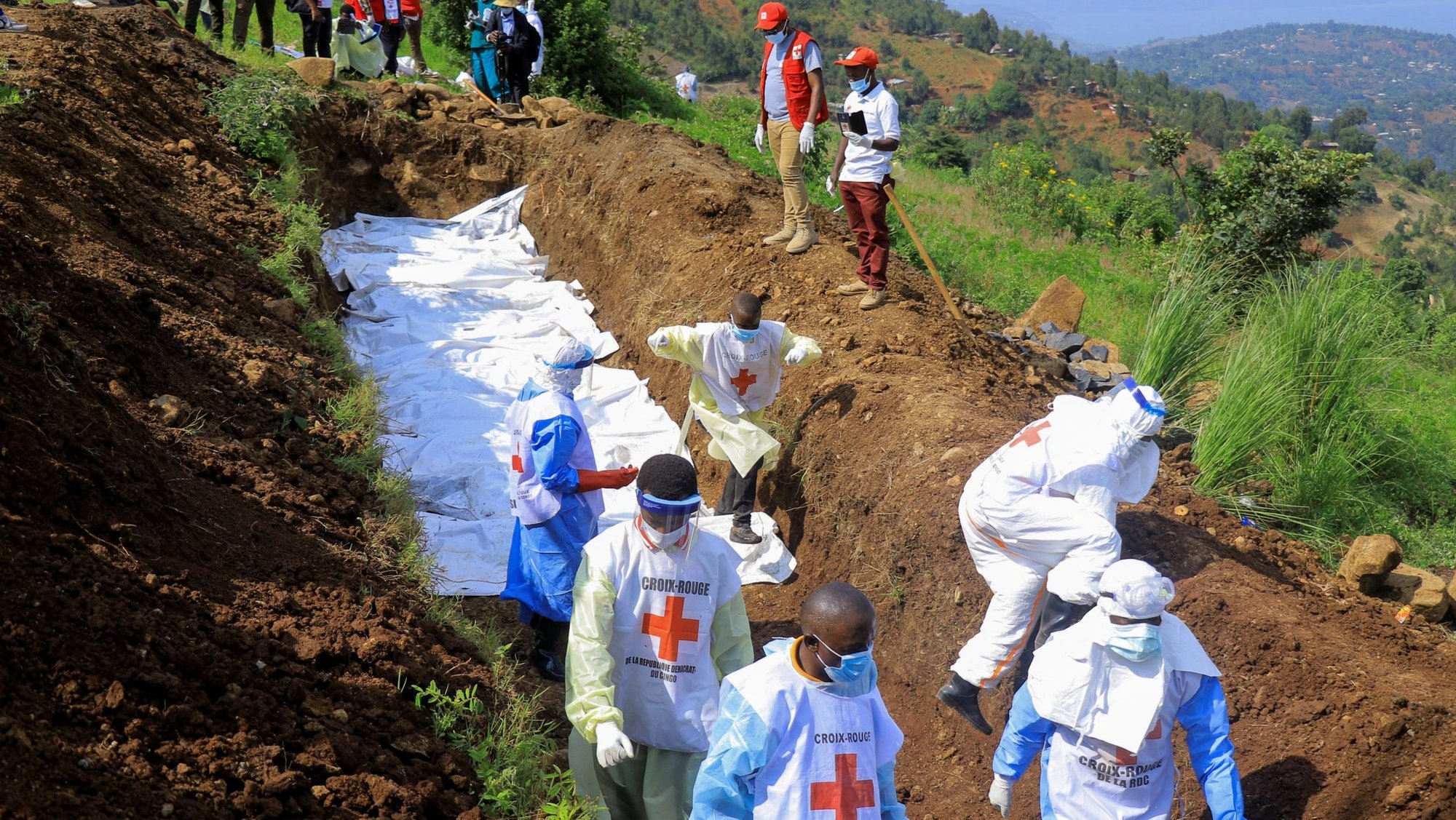 Congolese Red Cross members bury body bags in a mass grave at Musigoko cemetery in Bukavu, Congo, Feb. 20, 2025. The bags contained the remains of victims killed in recent clashes between M23 rebels and the armed forces of the Democratic Republic of the Congo (FARDC). (OSV News photo/Victoire Mukenge, Reuters)
