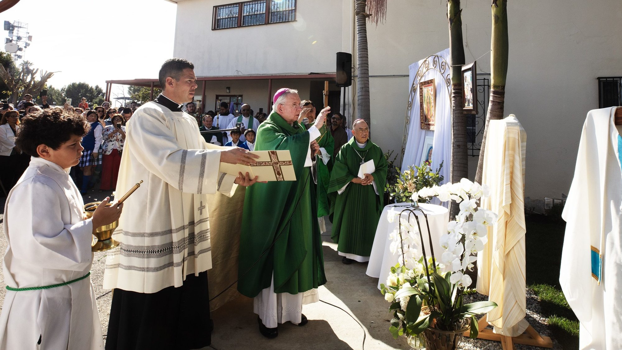 Archbishop José H. Gomez blesses the new memorial garden honoring late Bishop David O’Connell at St. Frances Xavier Cabrini Church in South LA Feb. 9, 2025. O’Connell served at the parish for more than 15 years. (Victor Alemán)