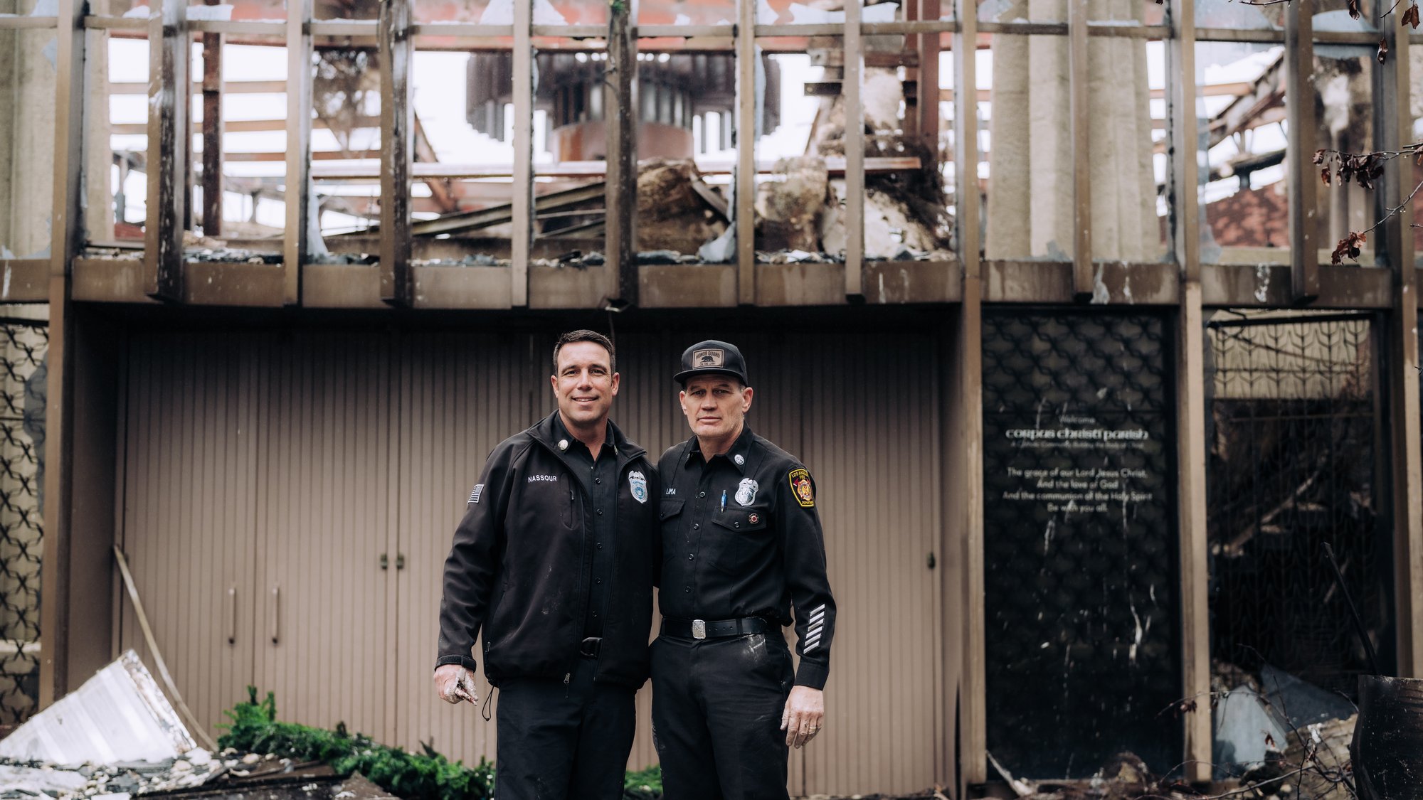 Los Angelus Fire Department Capt. Bryan Nassour, left, and Capt. Frankie Lima during a visit to the rubble of Corpus Christi Church in Pacific Palisades Feb. 5. (Isabel Cacho/Archdiocese of LA)