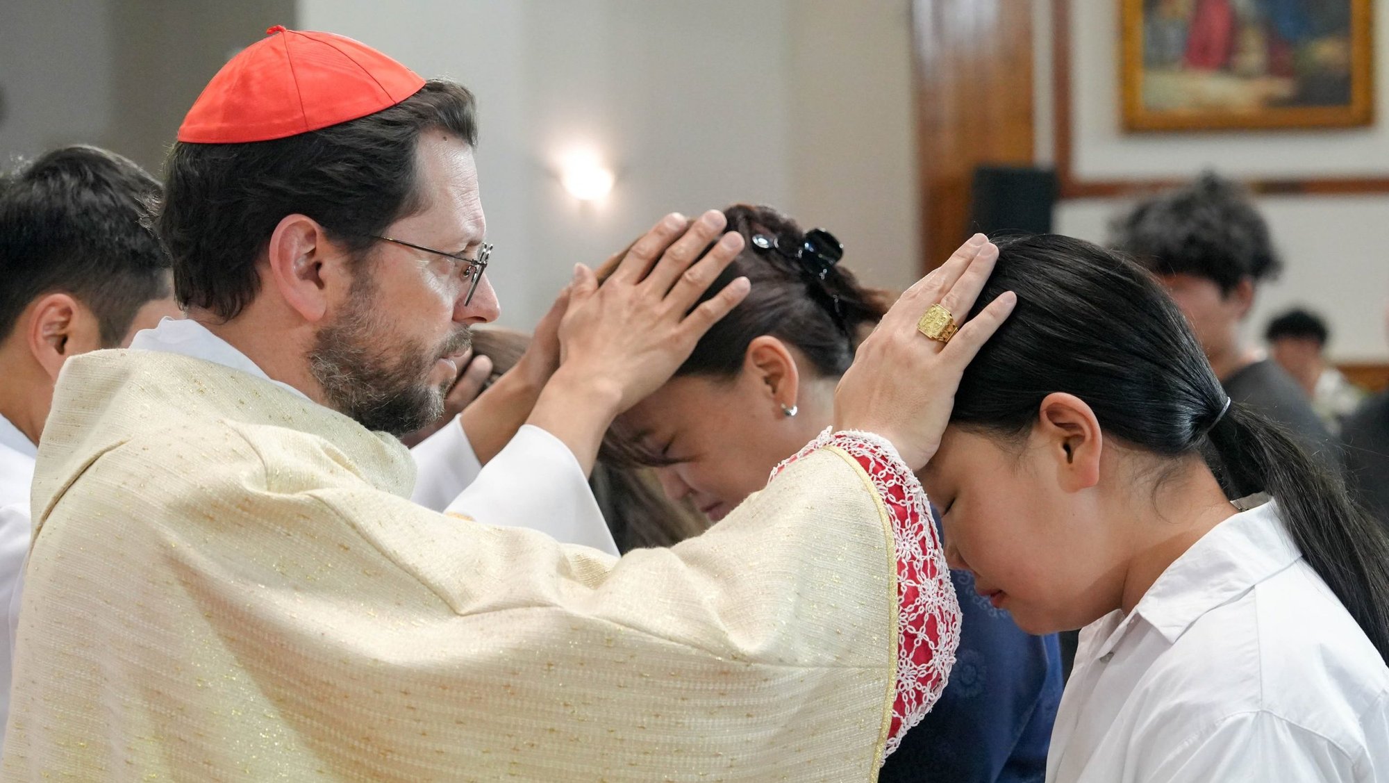 Cardinal Giorgio Marengo, apostolic prefect of Ulaanbaatar, Mongolia, administers the sacrament of confirmation in the Cathedral of Sts. Peter and Paul in Ulaanbaatar in this file photo from June 11, 2023. (CNS photo/Courtesy of the Apostolic Prefecture of Ulaanbaatar)
