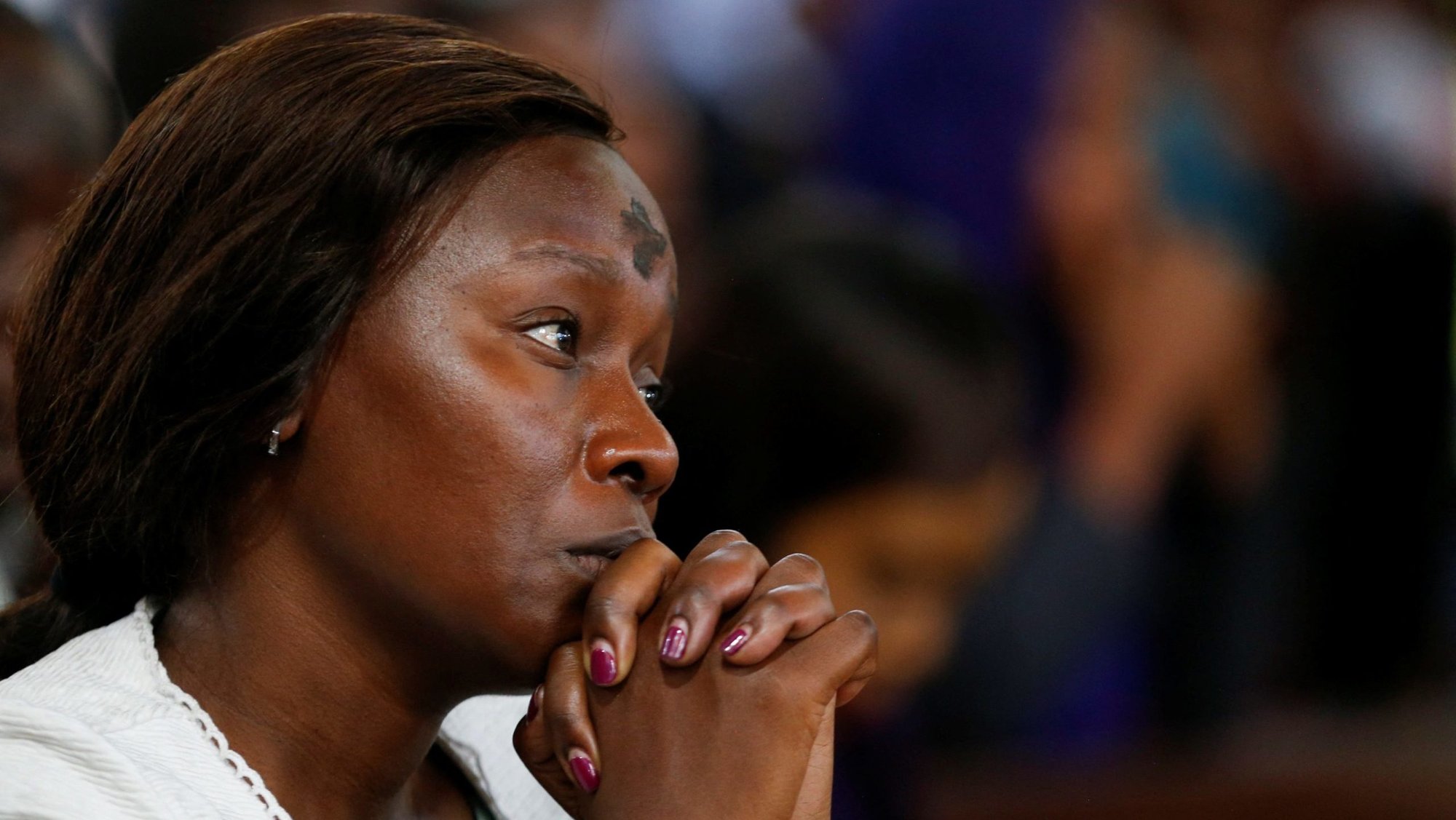 A woman marked with a cross on her forehead prays during Ash Wednesday Mass at the Cathedral Basilica of the Holy Family in Nairobi, Kenya, March 5, 2025. (OSV News photo/Thomas Mukoya, Reuters)