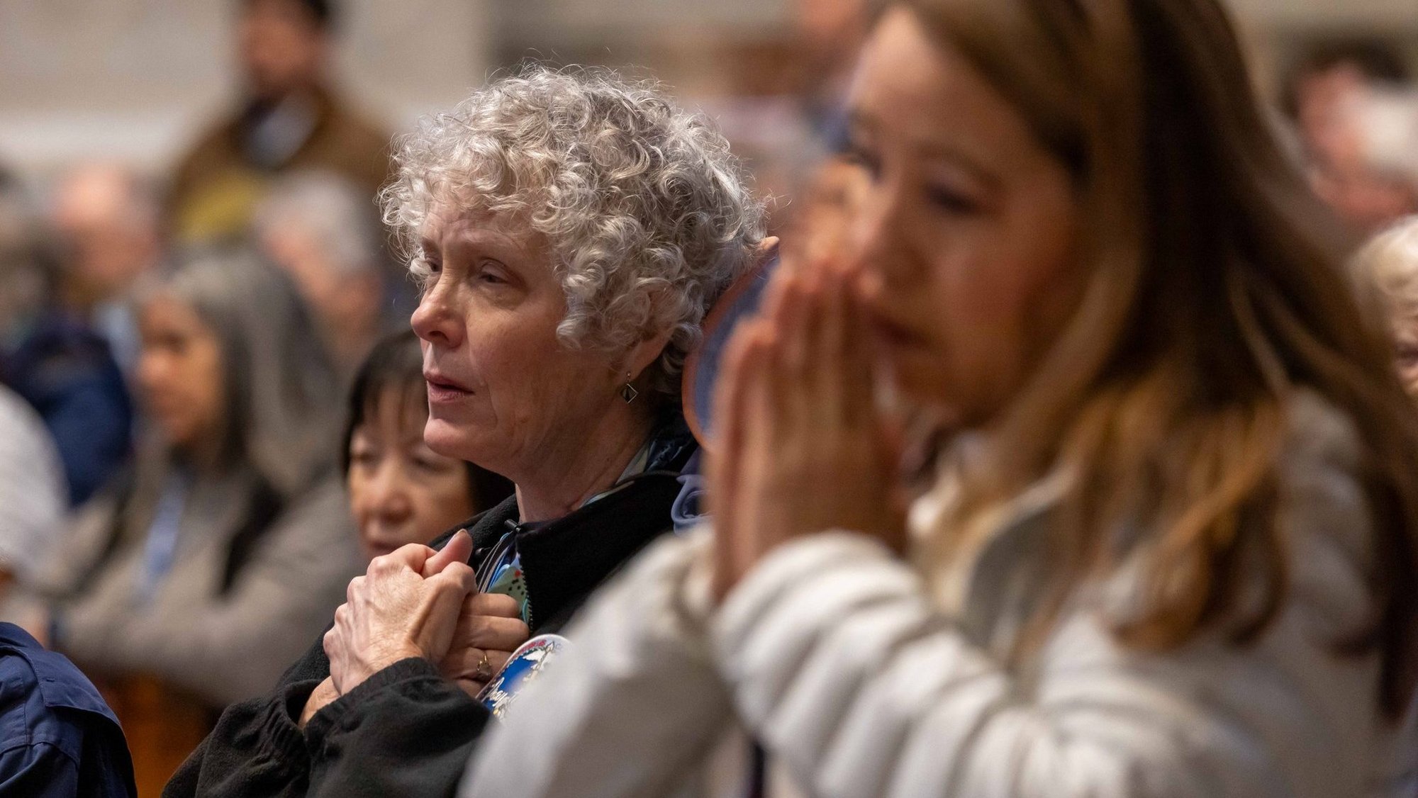 Women pray during a Mass with Holy Year pilgrims from the Diocese of Pittsburgh, the Diocese of San Bernardino, Calif., and St. Agnes School in St. Paul, Minn., at the Altar of the Chair in St. Peter's Basilica at the Vatican March 17, 2025. (CNS photo/Pablo Esparza)