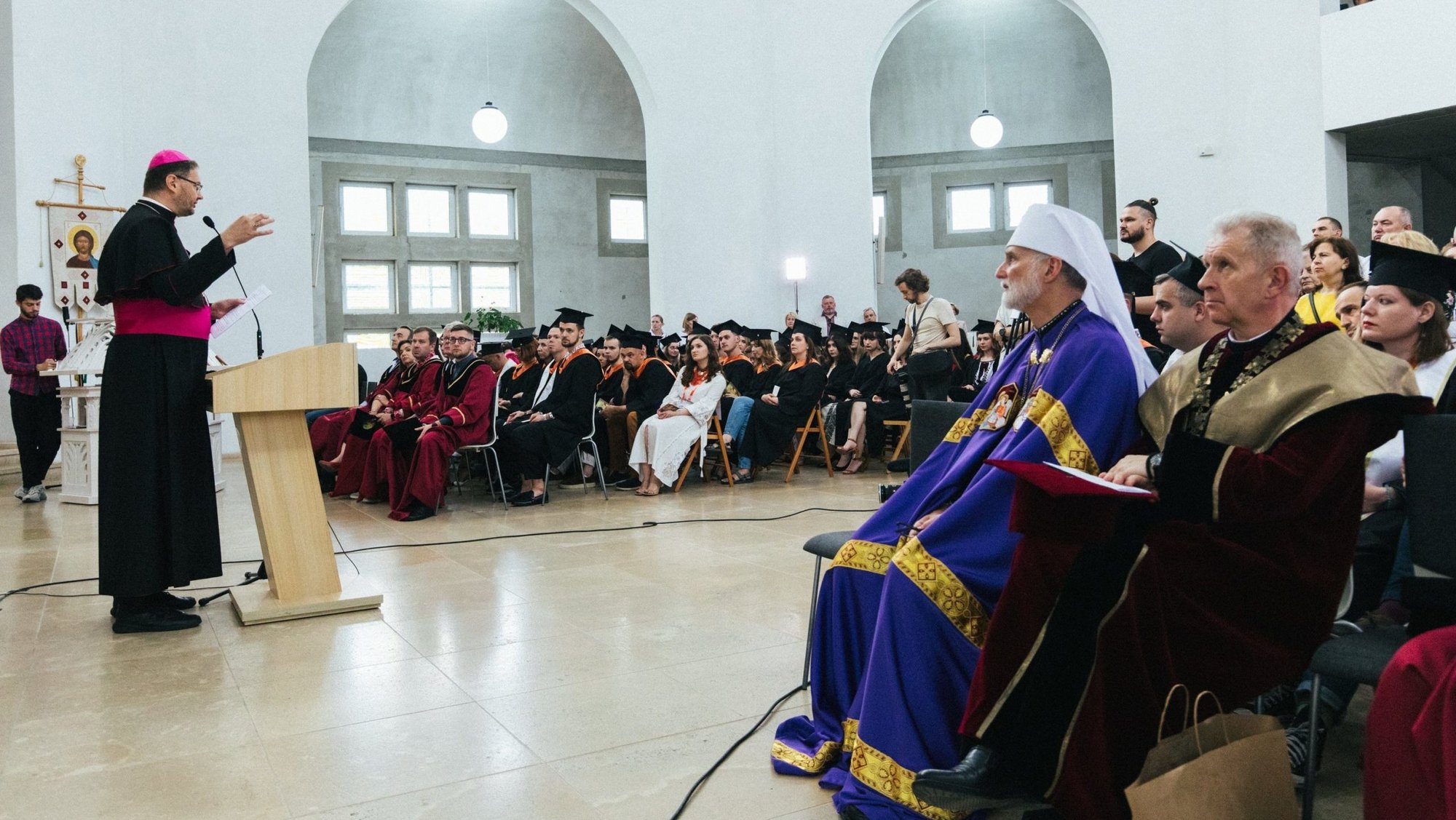 Archbishop Visvaldas Kulbokas, papal nuncio to Ukraine, addresses graduates of Ukrainian Catholic University in Lviv during a Divine Liturgy and commencement exercises July 2, 2023, at the school's Church of St. Sophia, Wisdom of God. (OSV News/Ukrainian Catholic University)