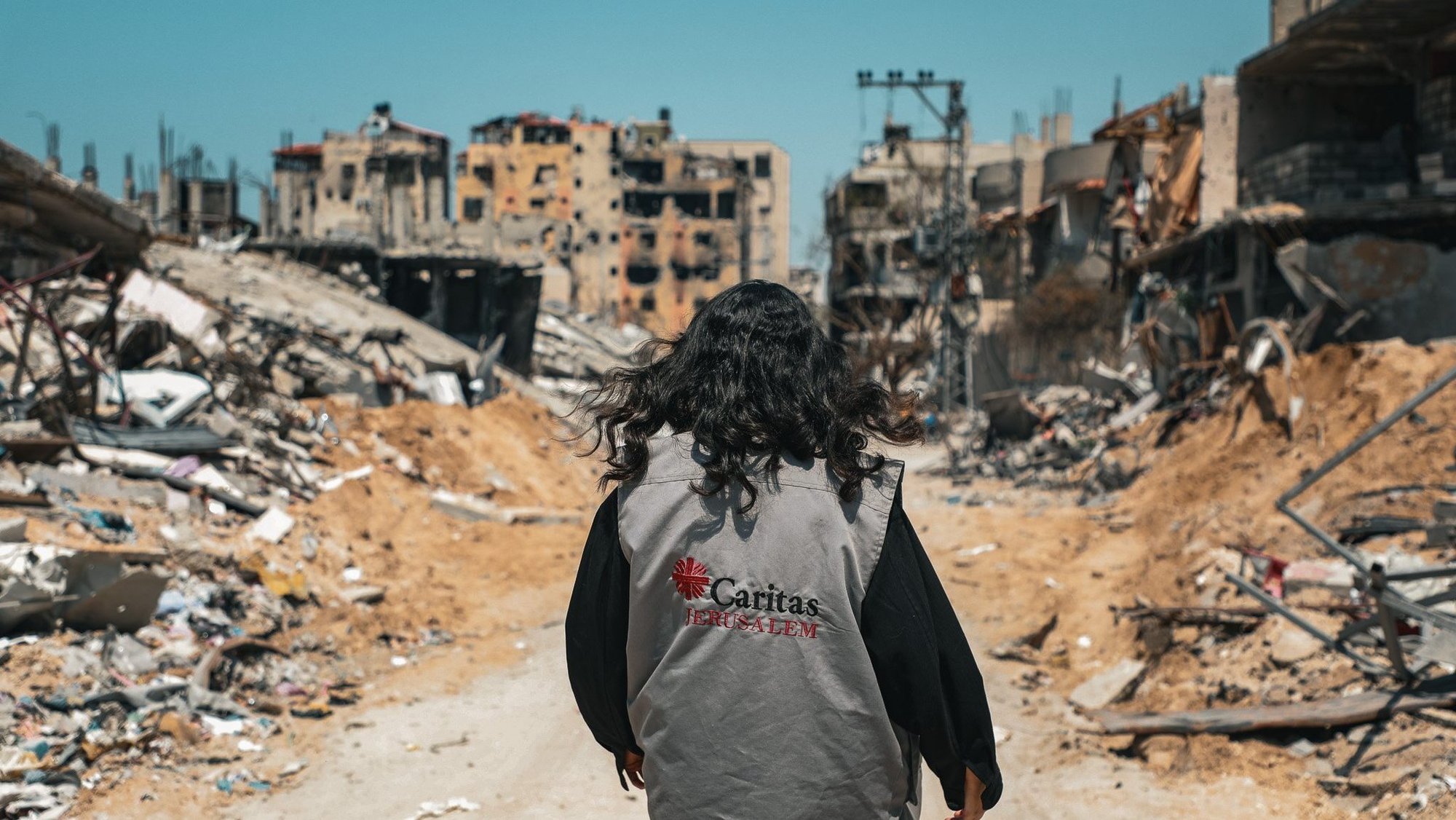 A Caritas worker walks through destroyed buildings in Gaza City March 16, 2024. (OSV News photo/courtesy Caritas Poland)