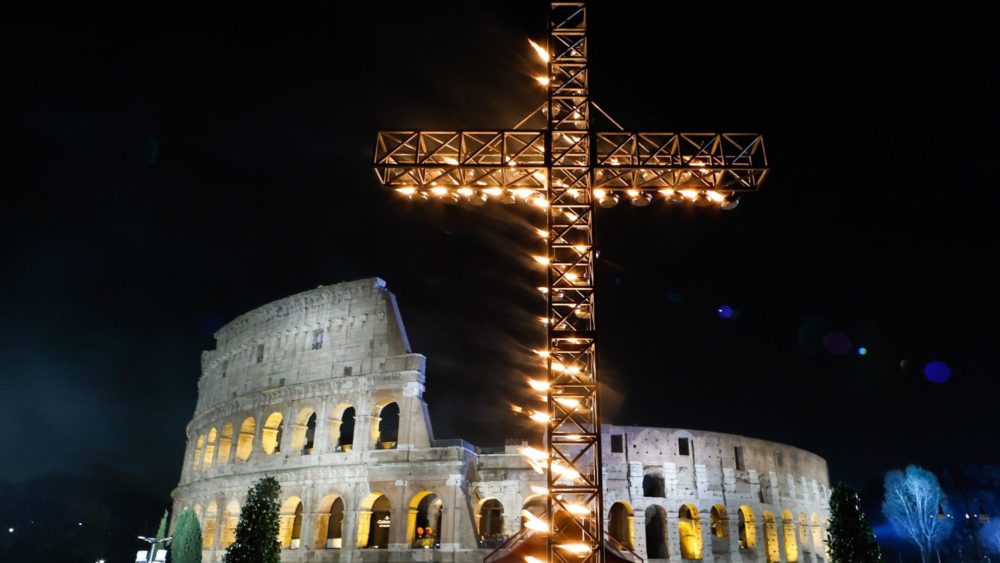A large illuminated cross is displayed before the start of the Way of the Cross outside the Colosseum in Rome March 29, 2024. (CNS photo/Lola Gomez)