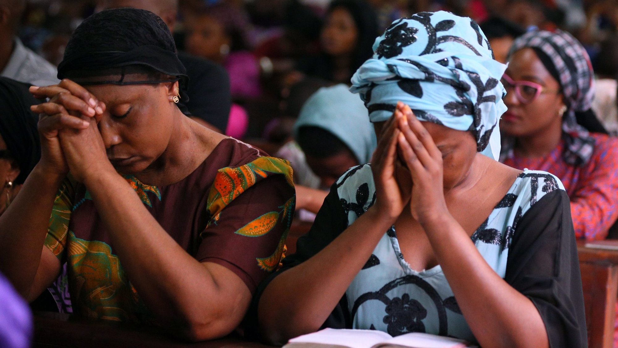 Women are pictured in a file photo praying during Mass at Holy Rosary Catholic Church in Abuja, Nigeria. (OSV News photo/Afolabi Sotunde, Reuters)