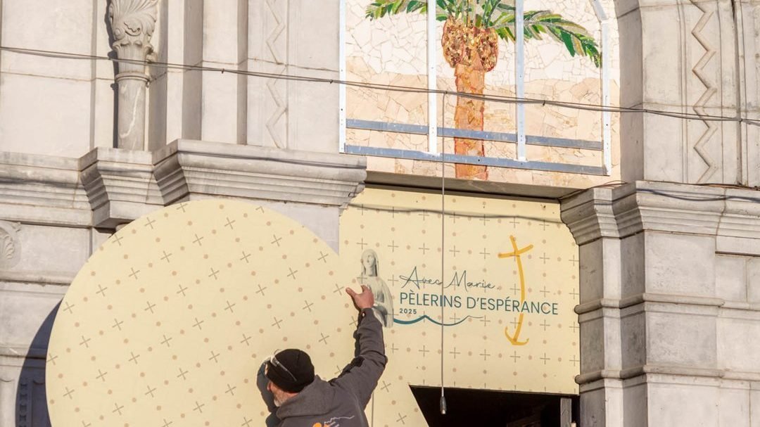 The mosaics on the doors of the facade of the Basilica of Our Lady of the Rosary, at the Sanctuary of Our Lady of Lourdes in southwestern France, are being covered in an undated photograph provided by the sanctuary. The doors showcase the artwork of Father Marko Rupnik, a priest and former Jesuit who is currently under investigation for alleged abuse of multiple women. On March 31, 2025, Bishop Jean-Marc Micas of Lourdes and Tarbes said the sanctuary would cover the mosaics on the doors to make the basilica more welcoming for all, particularly victims of abuse. (OSV News photo/courtesy Lourdes Sanctuary)