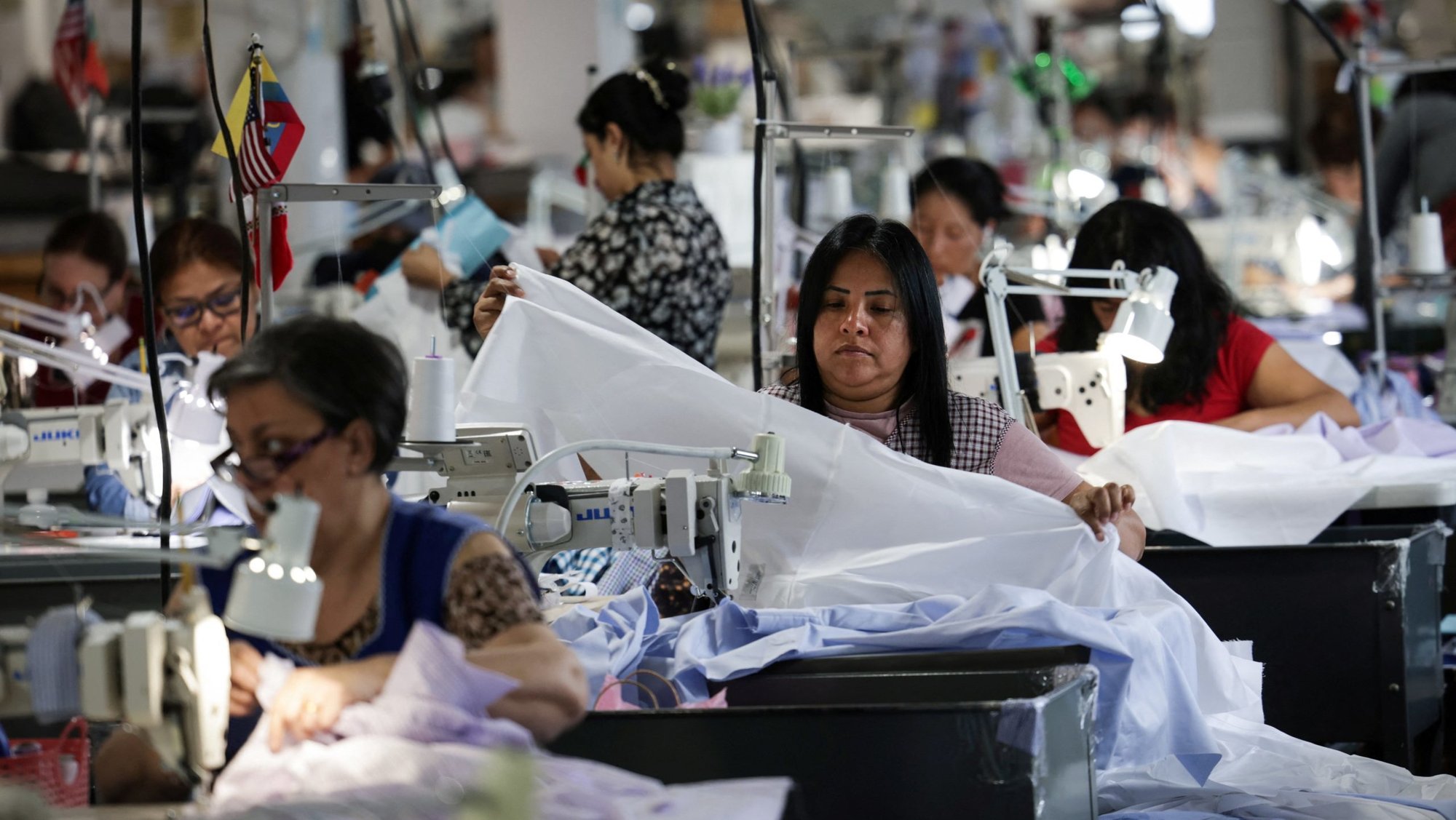 Employees are seen working on Gambert Shirts at company's manufacturing factory in Newark, N.J., March 5, 2025, amid tariffs enacted by the Trump administration. Gambert Shirts company has been a maker of high-quality custom dress shirts since 1933. (OSV News photo/Mike Segar, Reuters)