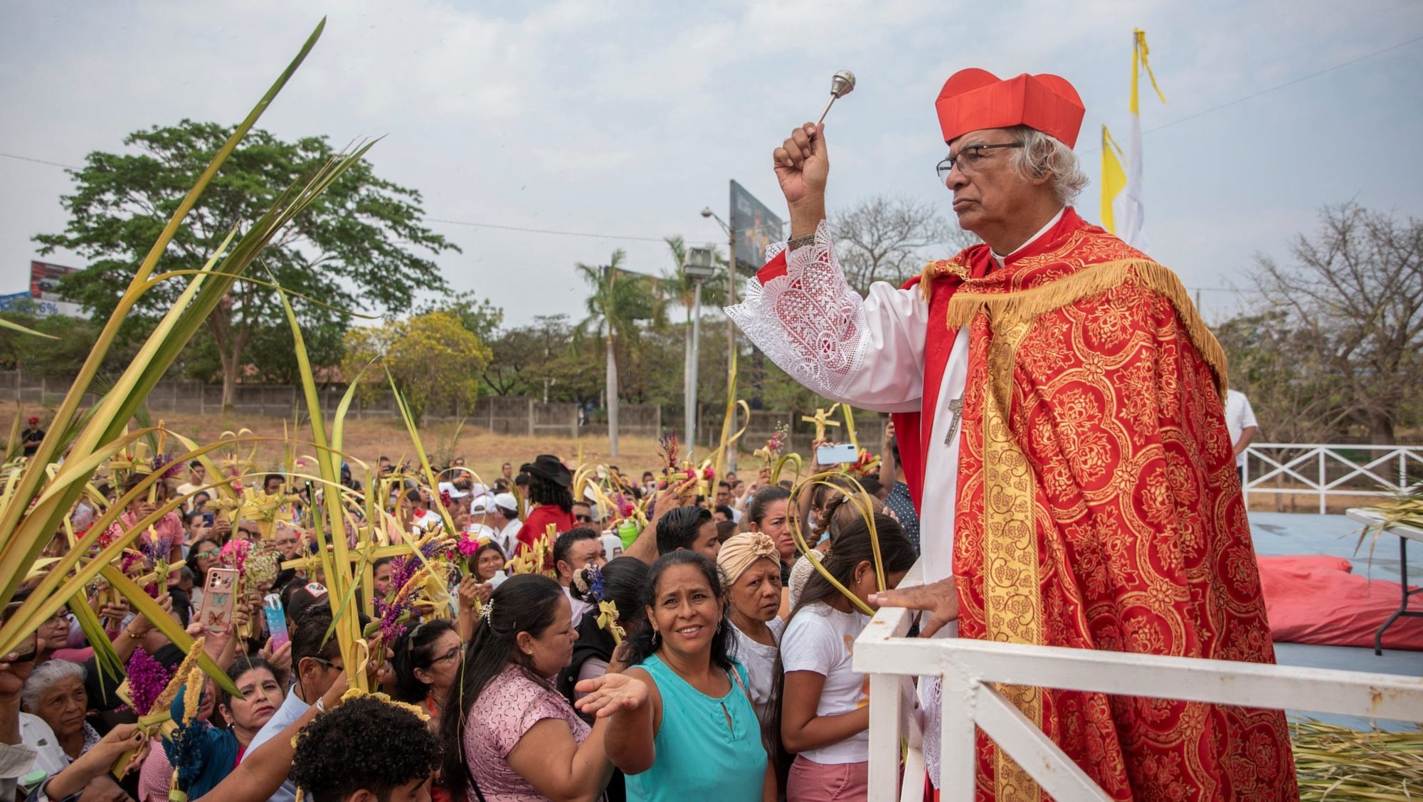 Nicaraguan Cardinal Leopoldo Brenes of Managua blesses people raising their palm fronds during Palm Sunday Mass March 24, 2024, in Managua. (OSV News photo/Maynor Valenzuela, Reuters)