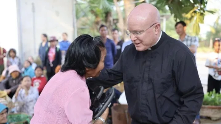 At a leper colony in the Kon Tum area in Vietnam, Pontifical Missions Society USA President Msgr. Roger Landry celebrated Mass, brought Communion to people, and distributed food and sandals. (The Pontifical Mission Societies/Margaret Murray)