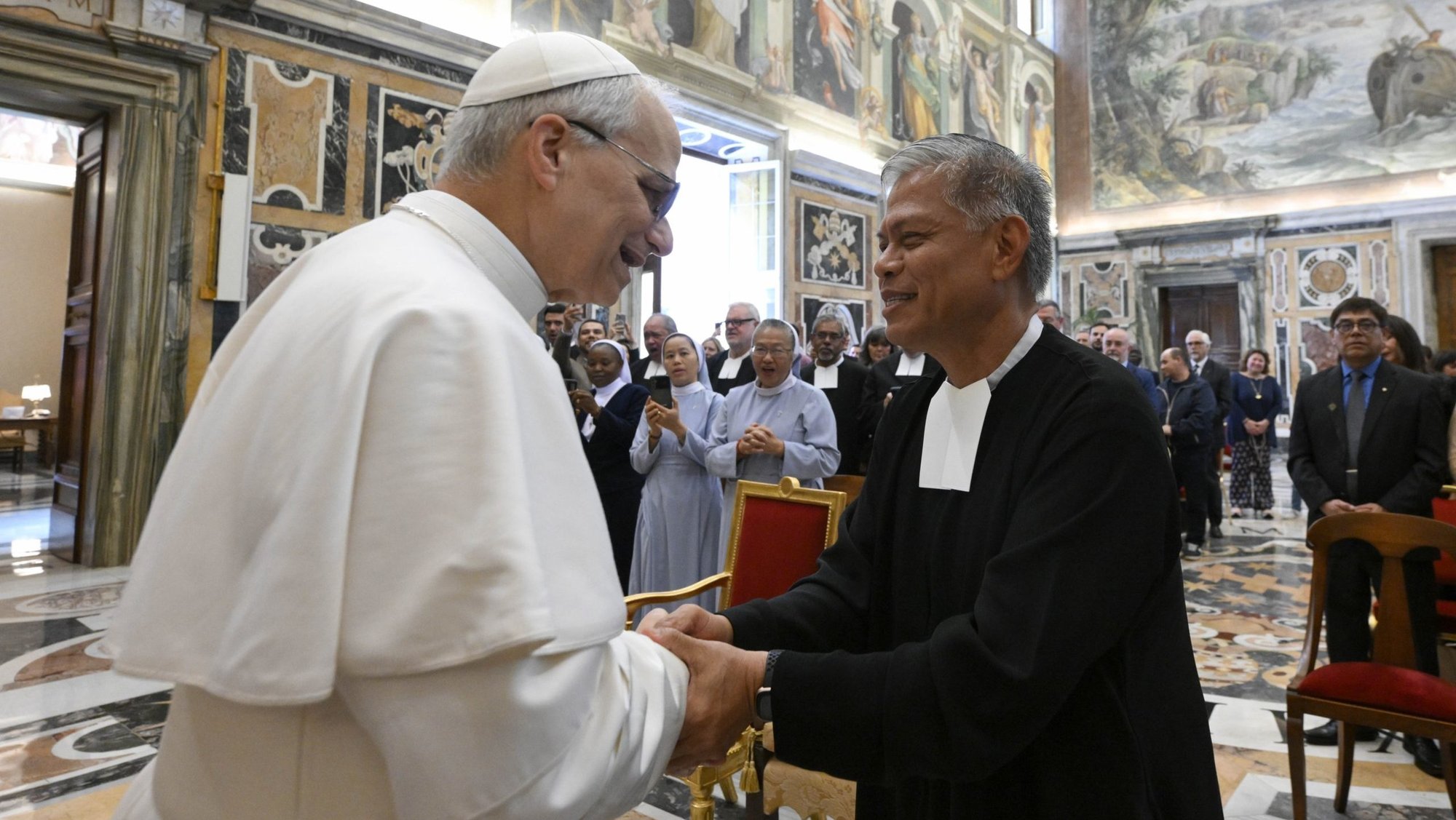 Pope Leo XIV greets Brother Armin Altamirano Luistro, superior of the De La Salle Christian Brothers, during an audience with members of the order at the Vatican May 15, 2025. (CNS photo/Vatican Media)