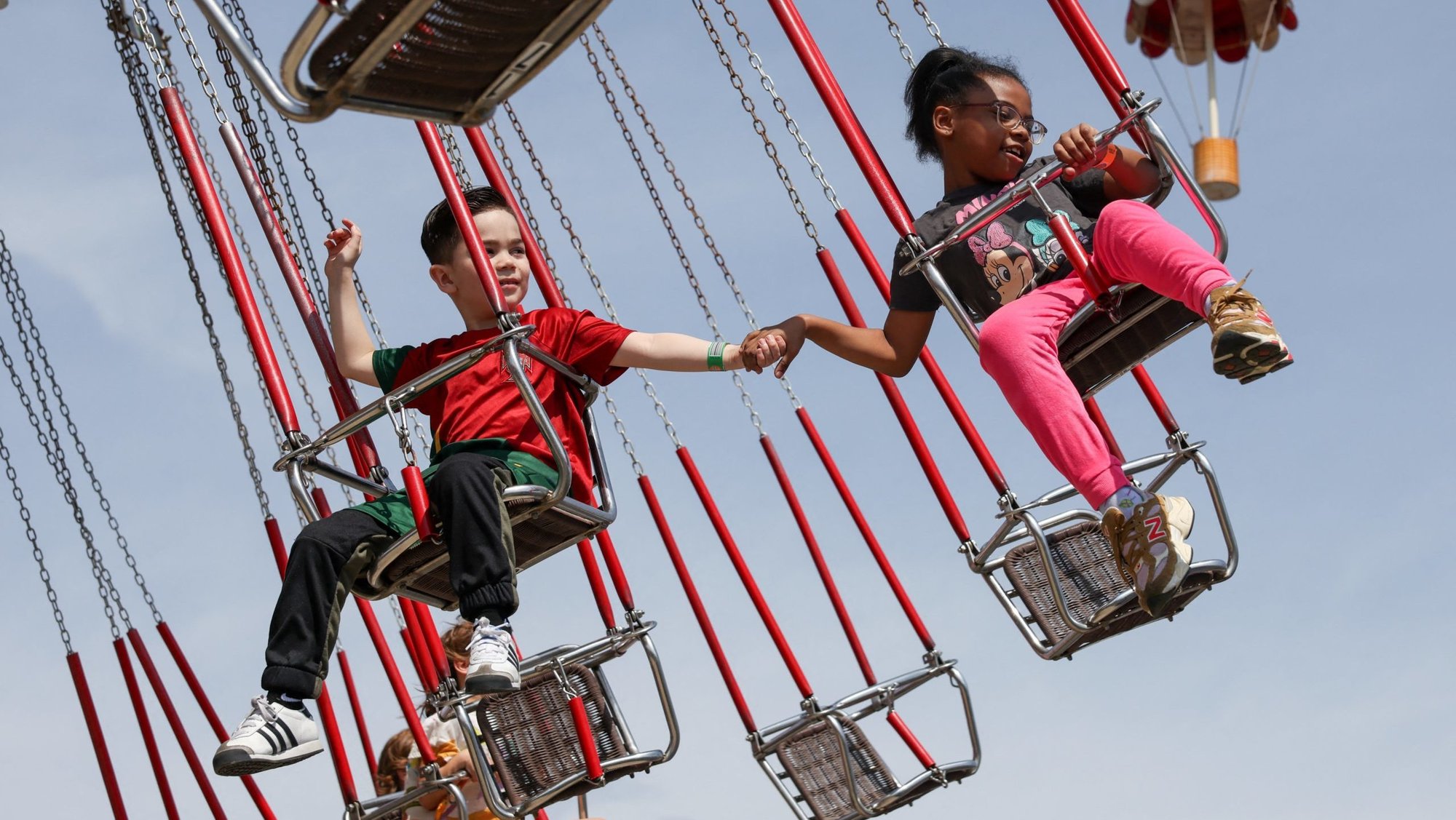Children hold hands on a ride at Luna Park in Coney Island on opening day of the season in Brooklyn, New York, March 29, 2025. (OSV News photo/Kylie Cooper, Reuters)