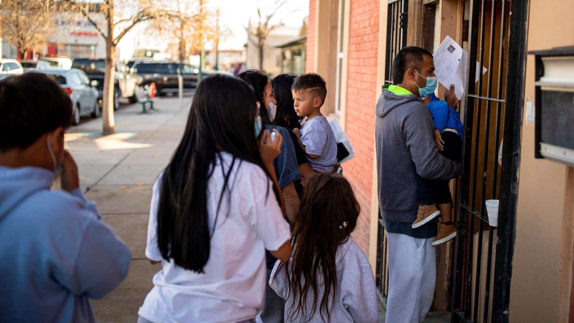 A migrant family is dropped off Dec. 13, 2022, at a local migrant shelter run by the Annunciation House in downtown El Paso, Texas. Texas Attorney General Ken Paxton has sought to shut down the shelter, alleging among other things that the organization facilitates illegal border crossings. On May 30, 2025, the Texas Supreme Court overturned a lower court ruling and said Paxton can move forward with his investigation into Annunciation House. (OSV News photo/Ivan Pierre Aguirre, Reuters)