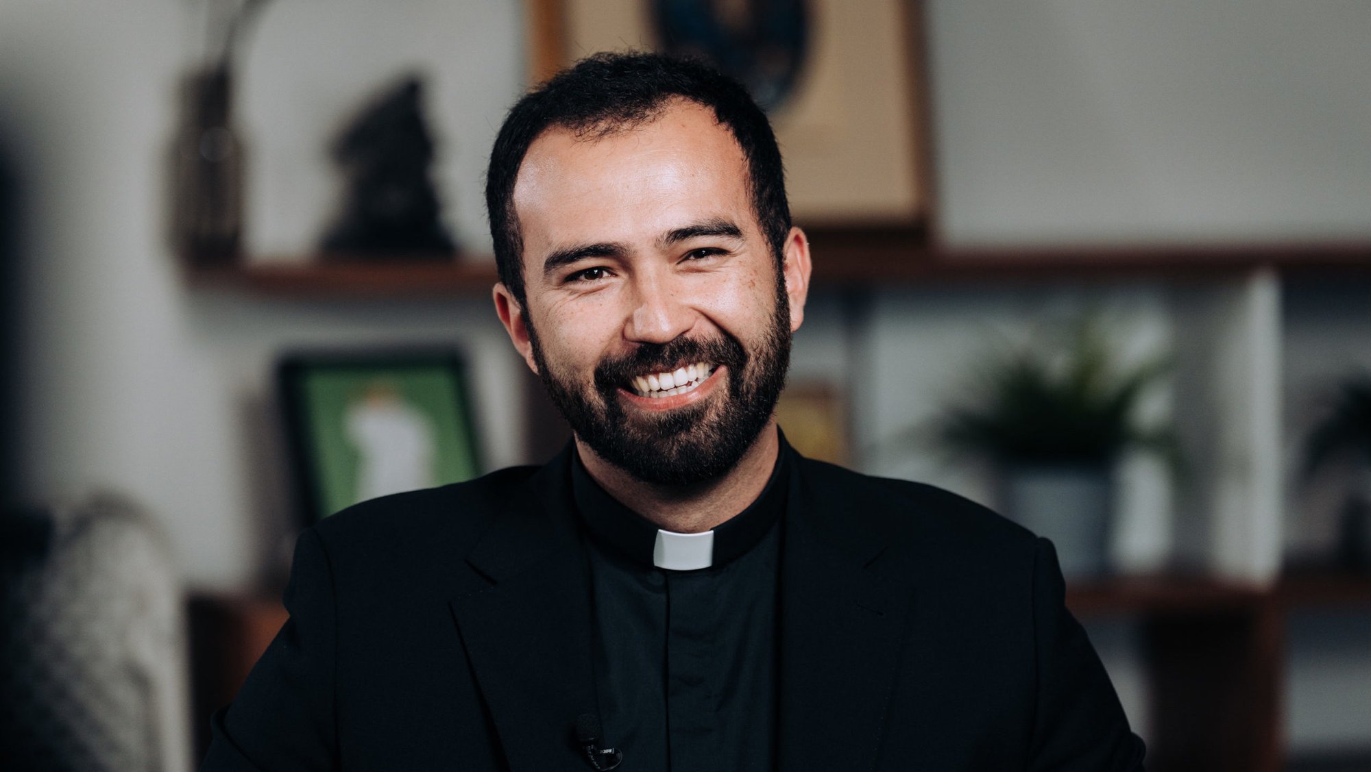 Christian Morquecho, a new priest ordained on May 31, sits during a video interview on April 8. (Isabel Cacho)