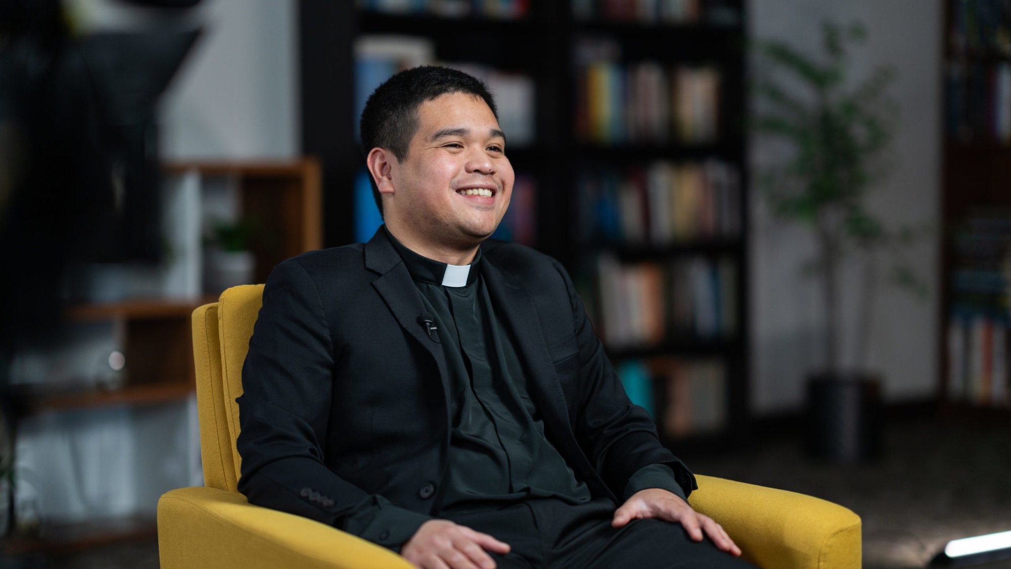 Johndy Gonzales, a new priest ordained on May 31, sits during a video interview on April 8. (Isabel Cacho)