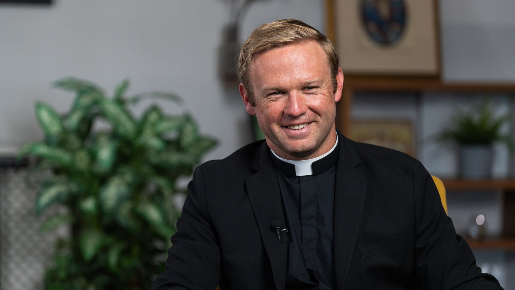 Paul Collins, a new priest ordained on May 31, sits during a video interview on April 8. (Isabel Cacho)