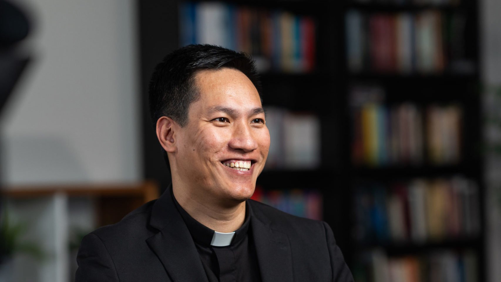 Quoc Vo, a new priest ordained on May 31, sits during a video interview on April 8. (Isabel Cacho)