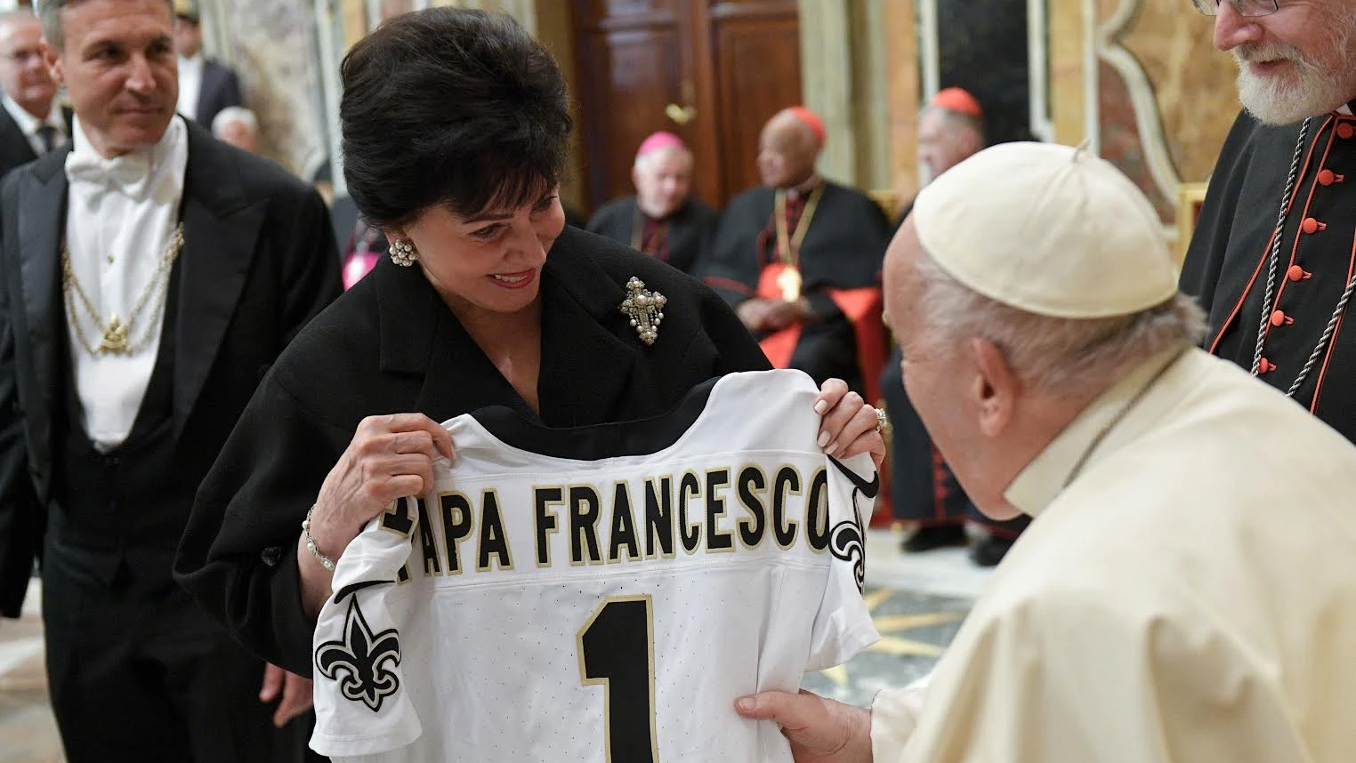 A member of the Papal Foundation greets Pope Francis with a personalized New Orleans Saints jersey, Friday, April 12, 2024. (CNA/Vatican Media)