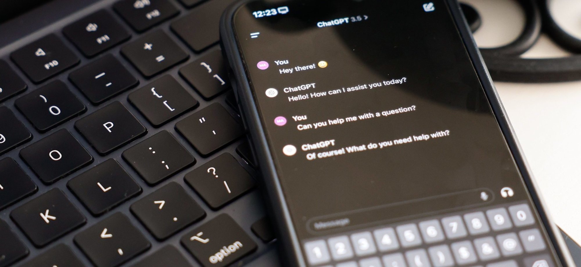 The ChatGPT app is seen on a phone placed atop a keyboard in this photo taken in Rome March 8, 2024. (CNS photo/Lola Gomez)