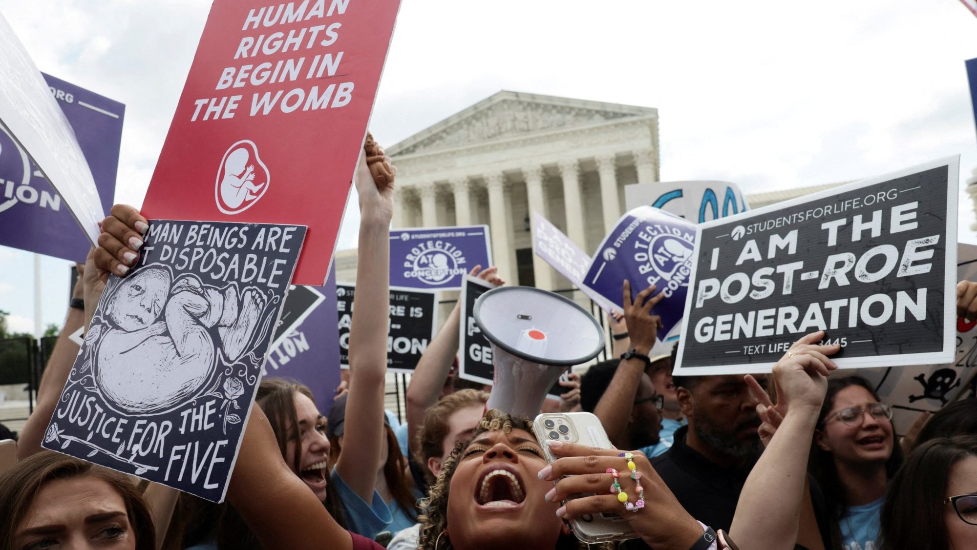 Pro-life demonstrators in Washington celebrate outside the U.S. Supreme Court June 24, 2022, as the court overruled its landmark Roe v. Wade abortion precedent in its Dobbs v. Jackson Women's Health Organization ruling. The case involved a Mississippi law banning most abortions after 15 weeks. (OSV News photo/Evelyn Hockstein, Reuters)