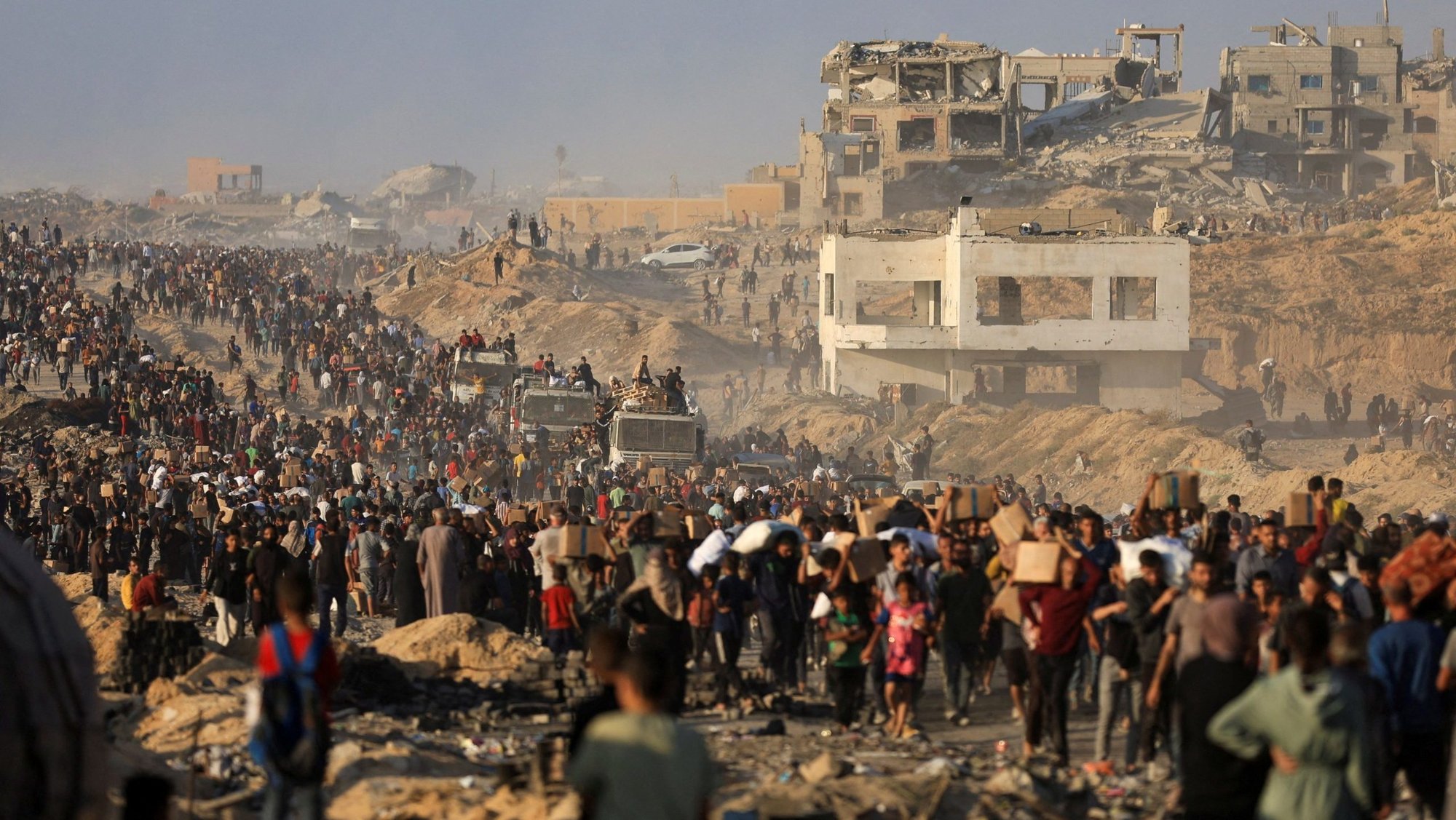 Palestinians gather to receive aid supplies in Beit Lahia, in the northern Gaza Strip, June 16, 2025, after being displaced by the Israeli military offensive. (OSV News photo/Dawoud Abu Alkas, Reuters)