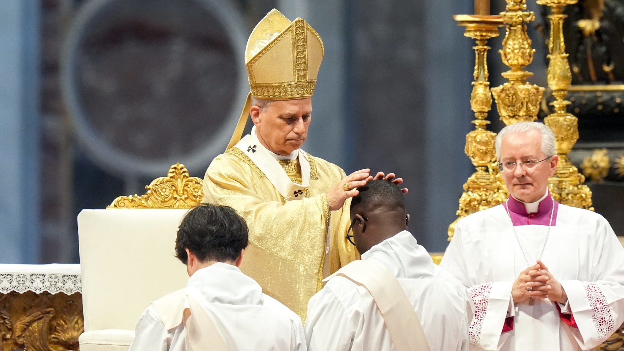 Pope Leo XIV lays hands on an ordinand during Mass on the feast of the Sacred Heart of Jesus in St. Peter’s Basilica at the Vatican June 27, 2025. The pope ordained 32 men from five continents. (CNS/Lola Gomez)