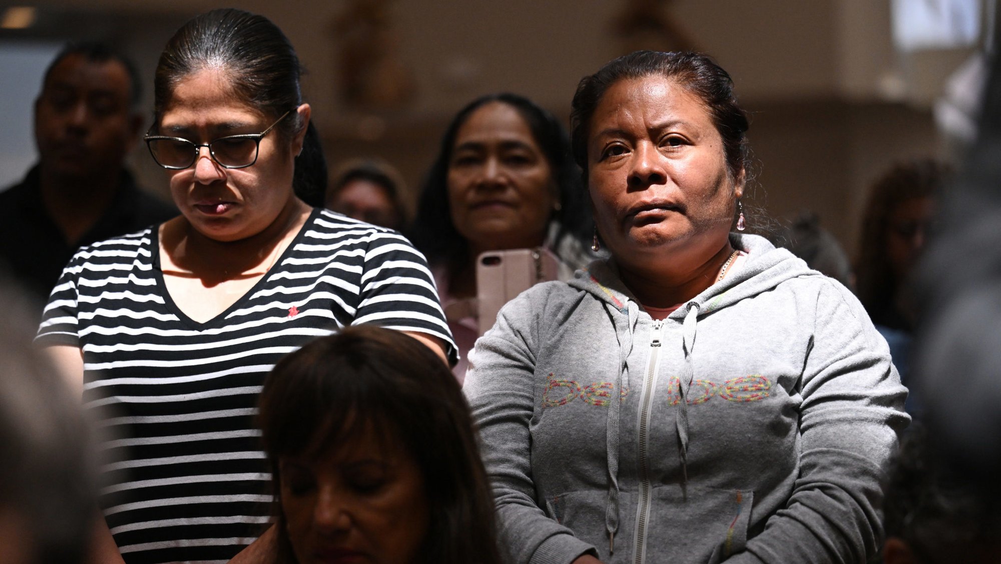 Latina parishioners pray at St. Patrick Church near downtown LA on July 23. (John McCoy)