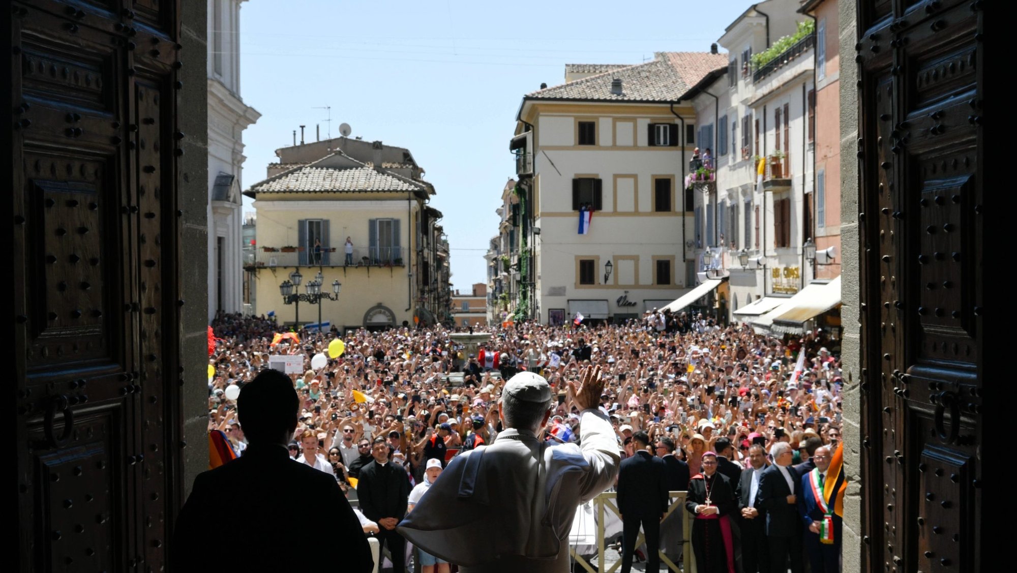Pope Leo XIV greets visitors ahead of the Angelus prayer in Castel Gandolfo, Italy, July 20, 2025. (CNS/Vatican Media)