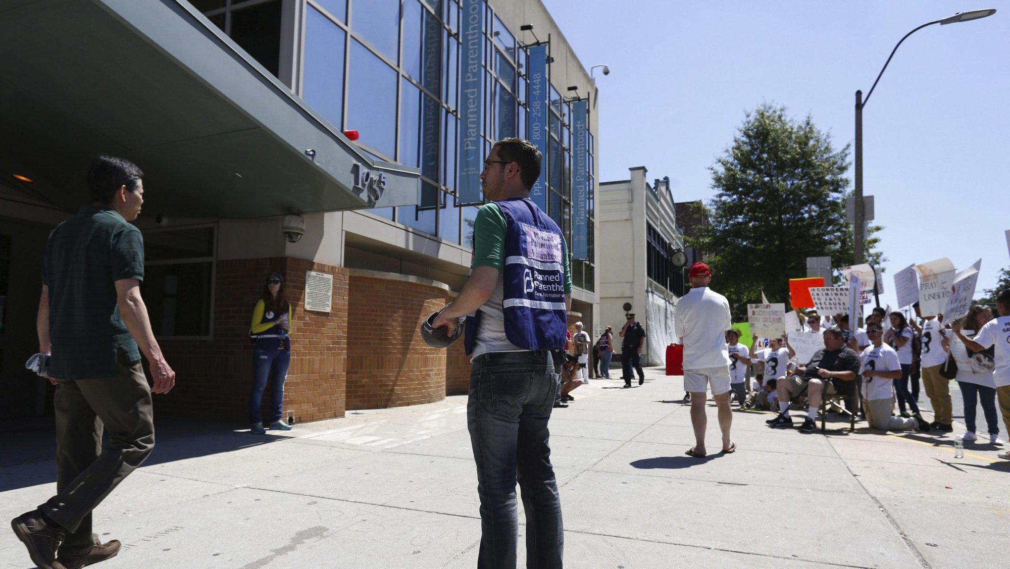 A volunteer stands in front of a Planned Parenthood clinic in Boston, Massachusetts, June 28, 2014. (OSV News/Dominick Reuter, Reuters)