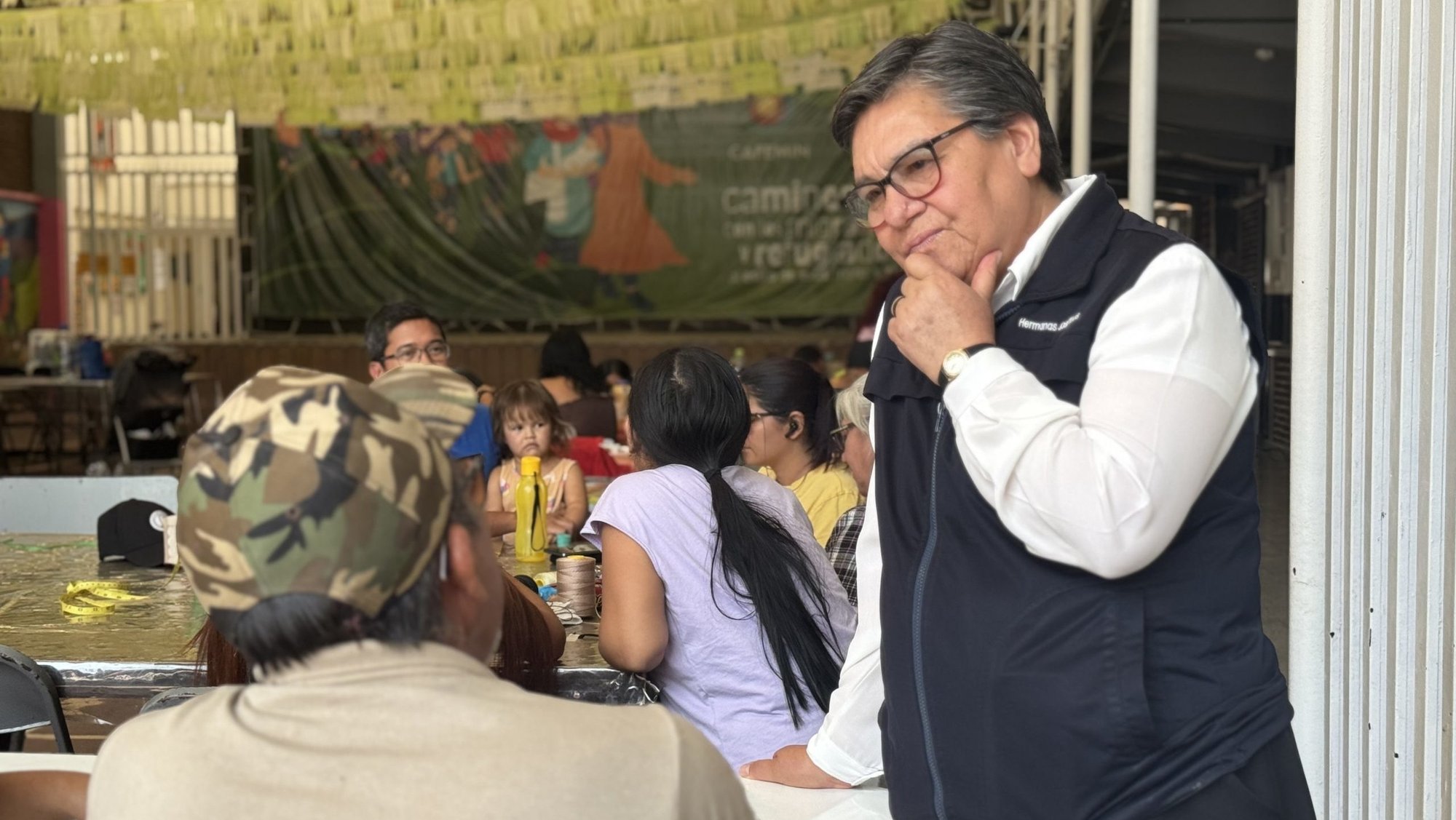 Sister María Magdalena Silva Rentería listens to a man looking for work April 1, 2025, at the CAFEMIN shelter in Mexico City. The shelter, run by the Josephine sisters, is among those scrambling to help migrants who abandoned their journey north to the U.S.-Mexico border and are trying to travel south, back to their country of origin, amid Mexico's restrictions on migrants' movements. (OSV News photo/Rhina Guidos, Global Sisters Report)