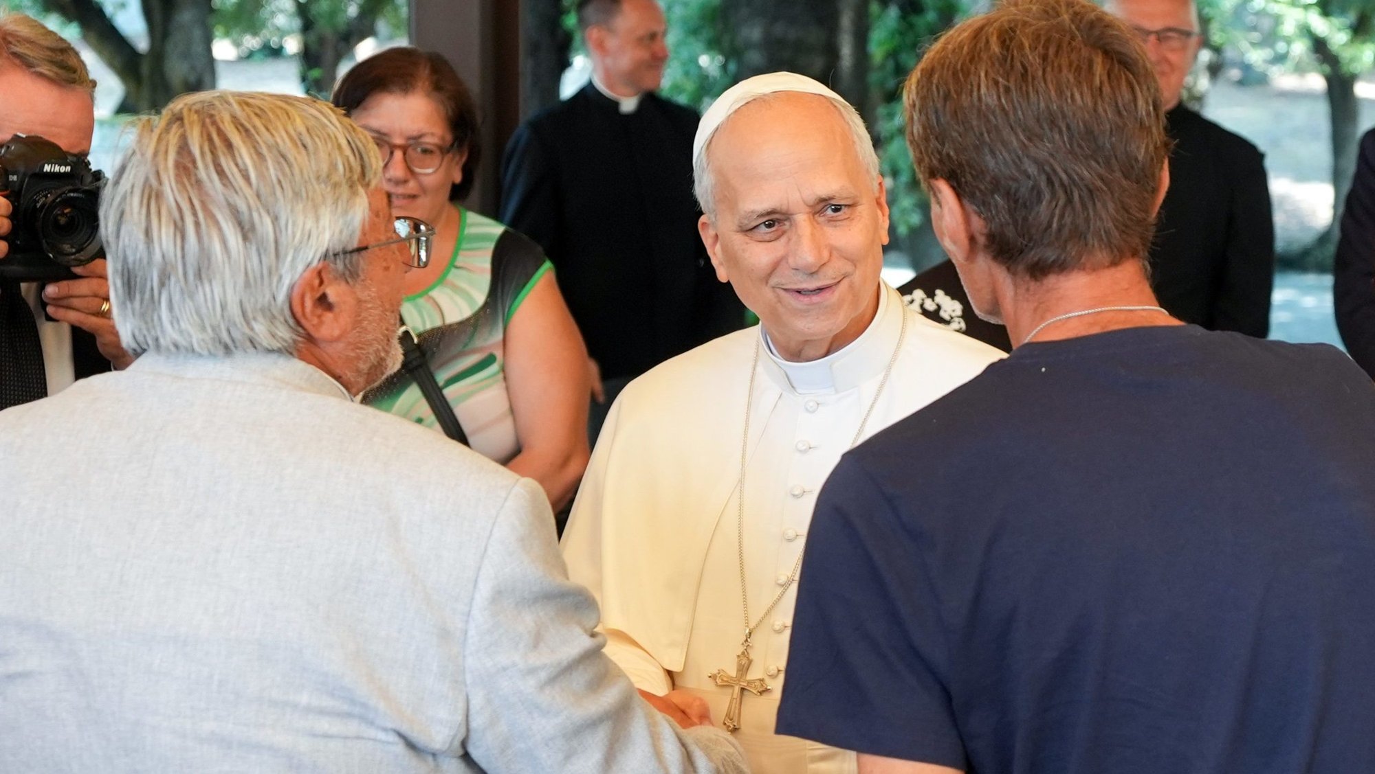 Pope Leo XIV greets lunch guests assisted by the Albano diocesan Caritas agency at the Borgo Laudato Si’ in Castel Gandolfo, Italy, Aug. 17, 2025. The luncheon with the pope followed a Mass the pope celebrated in nearby Albano Laziale. (CNS photo/Lola Gomez)