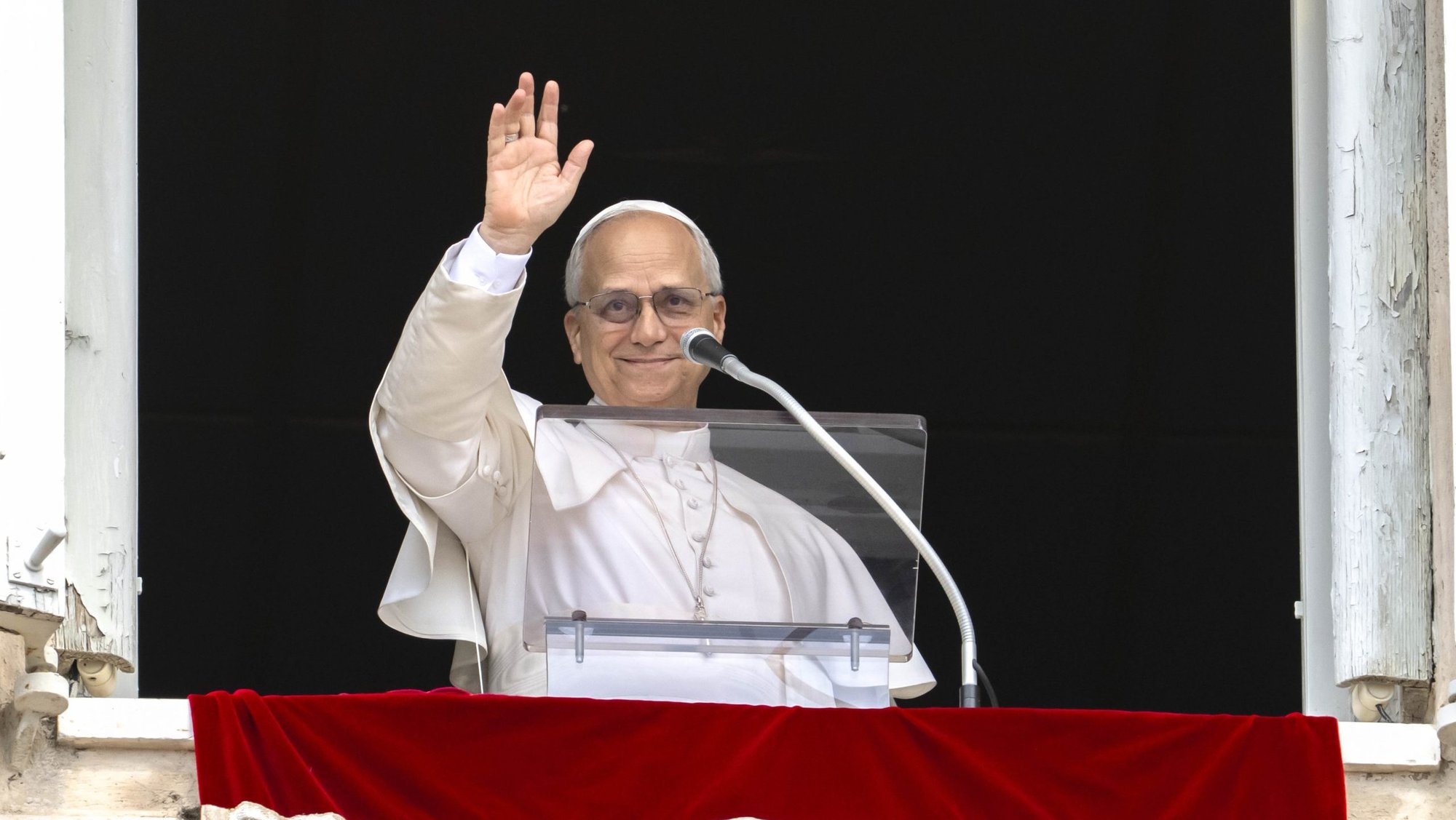 Pope Leo XIV waves after leading the recitation of the Angelus prayer with visitors gathered in St. Peter's Square at the Vatican Aug. 24, 2025. After the Angelus, Pope Leo asked people to pray for peace in Ukraine as the country marked its Independence Day. (CNS photo/Vatican Media)