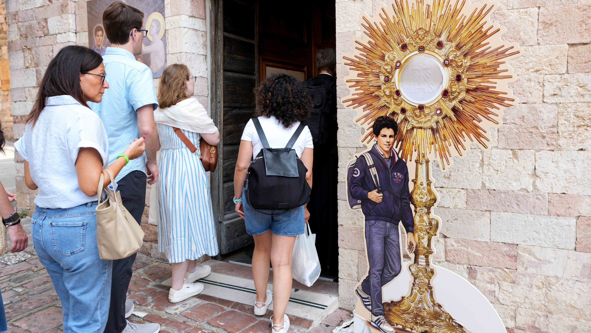 Pilgrims enter the Shrine of the Renunciation, where Blessed Carlo Acutis is buried, in Assisi, Italy, Aug. 21, 2025. Acutis who died in 2006, will be canonized Sept. 7 at the Vatican by Pope Leo XIV. (CNS photo/Lola Gomez)