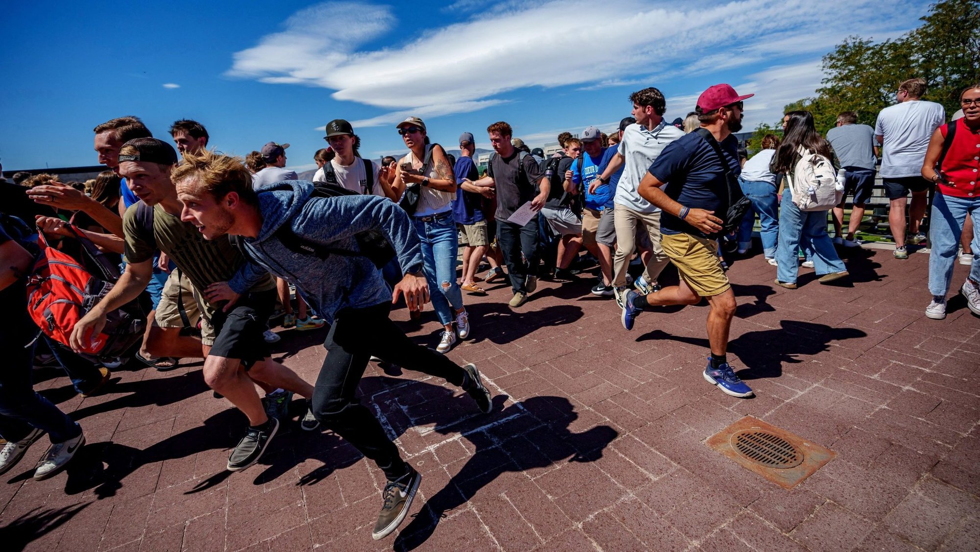 People run after a shot was fired at U.S. right-wing activist and commentator Charlie Kirk during a Utah Valley University speaking event in Orem, Utah, Sept. 10, 2025. (OSV News photo/Trent Nelson, The Salt Lake Tribune via Reuters)