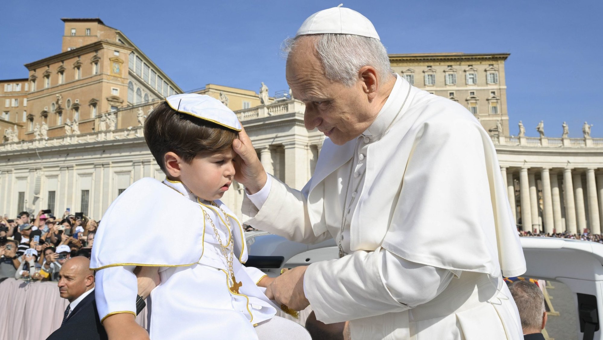 Pope Leo XIV greets a child dressed as the pope as he rides in the popemobile during the weekly general audience in St. Peter's Square at the Vatican Sept. 17, 2025. (CNS photo/Vatican Media)