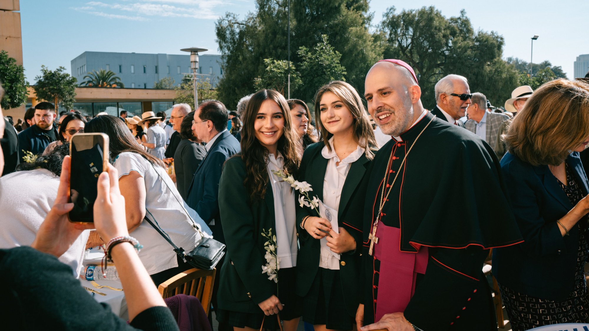 New York Auxiliary Bishop Joseph Espaillat greets young people following his keynote speech at the LA Catholic Prayer Breakfast on Sept. 16. (Peter Lobato)